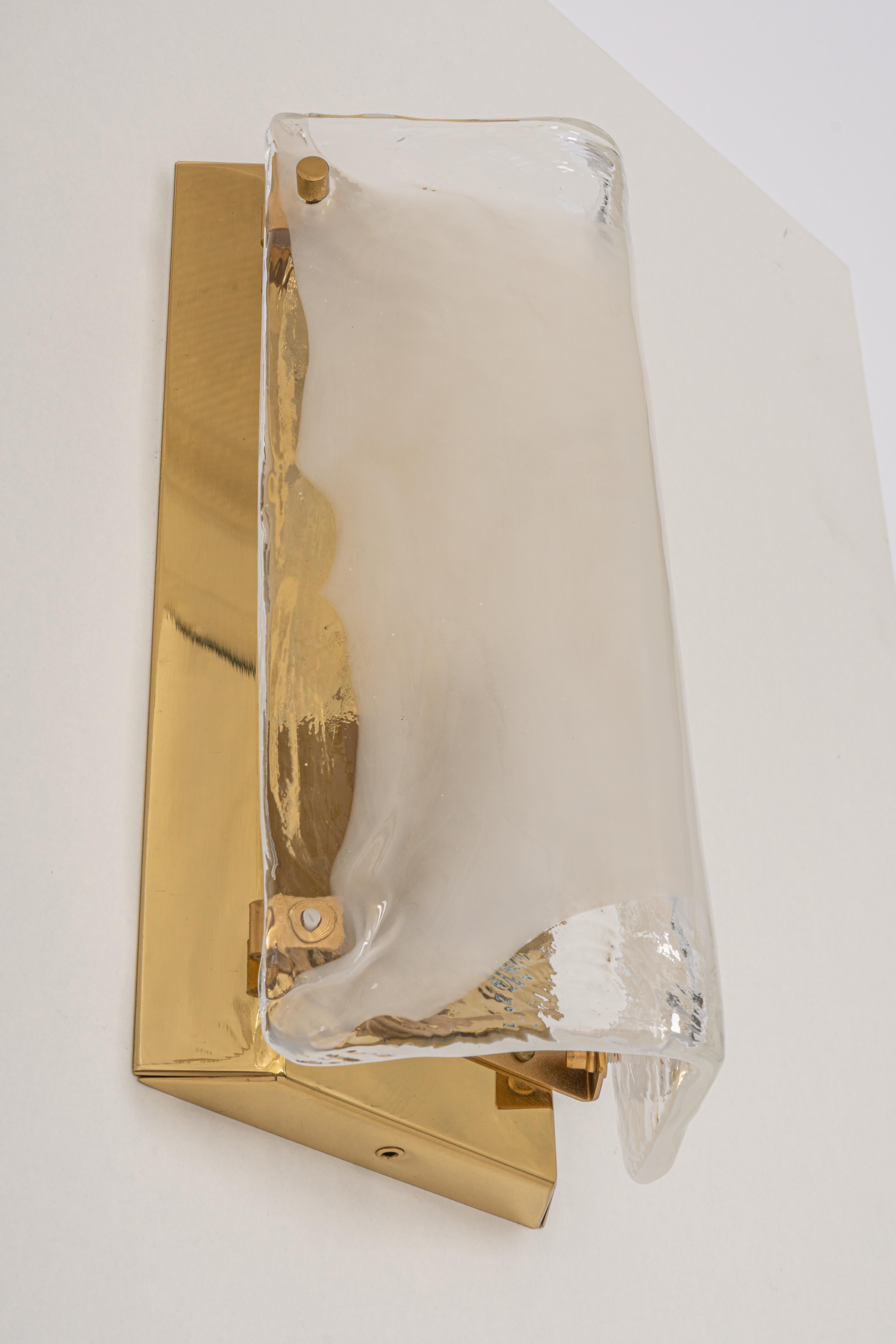 Wonderful mid-century wall sconce with Murano glass, made by Kalmar, Austria, manufactured, circa 1960-1969.
The frame is gilt brass.
High quality and in very good condition. Cleaned, well-wired, and ready to use.  

Each sconce requires 1 x E14