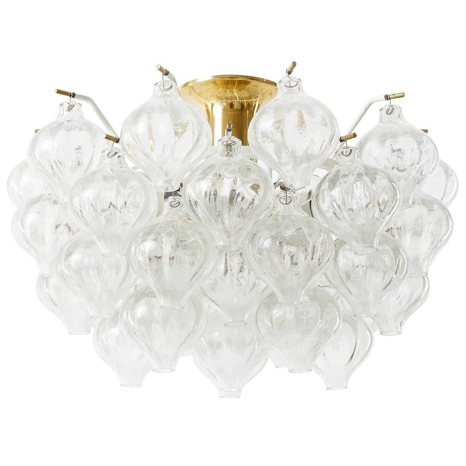 One of two gorgeous light fixtures model Tulipan by J.T. Kalmar, Vienna, Austria, manufactured in midcentury, circa 1970 (late 1960s or early 1970s).
The name Tulipan derives from the tulip shaped handblown bubble glasses. Each glass is handmade and