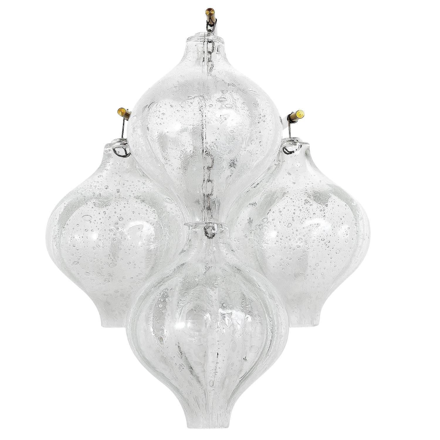 A pair of 'Tulipan' glass wall light fixtures by J.T. Kalmar, Austria, Vienna, manufactured in midcentury, circa 1970 (late 1960s or early 1970s).
Currently two pairs are available. 
The name Tulipan derives from the tulip shaped hand blown bubble