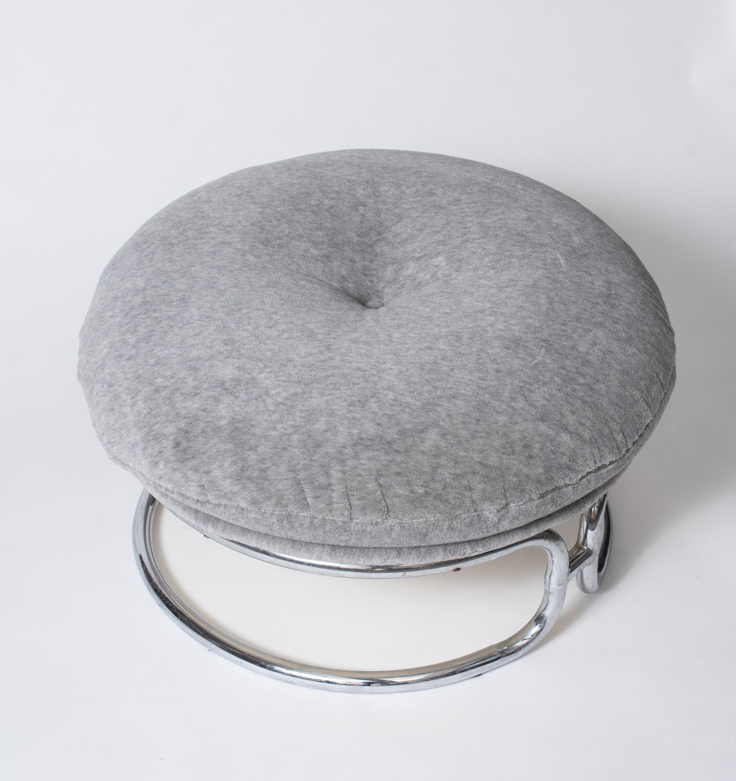A pair of ottomans in white fiberglass shell accommodating a fabric-covered cushion with grey « Alpaga » wool from Bisson-Bruneel.
Tubular chromed metal base forming two semi-circles connected to each other.

Biography

Born in 1942, Michel Cadestin