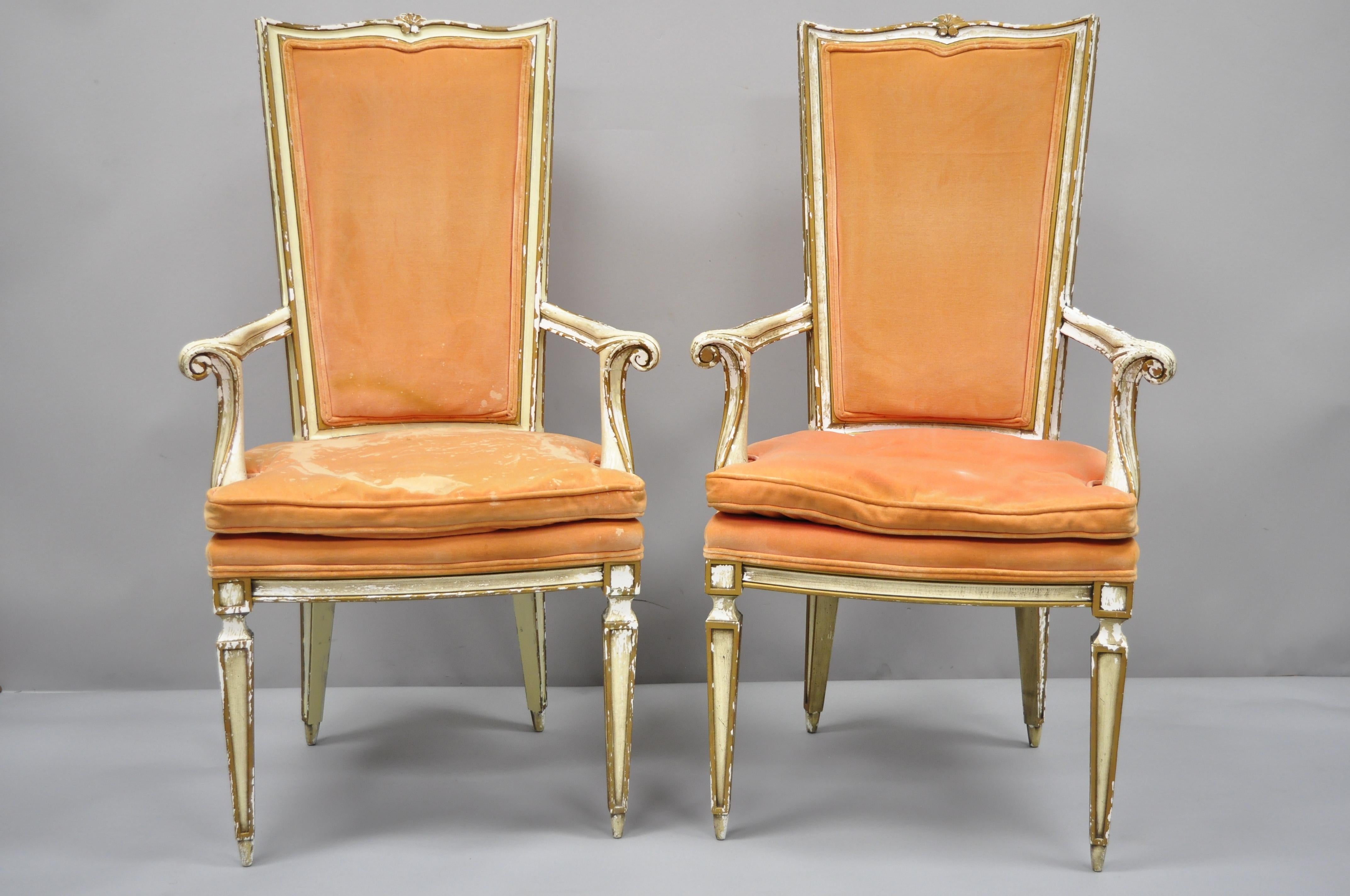 Pair of Karges Italian Venetian cream and gold distress painted dining armchairs. Item features distressed cream and gold finish, solid wood construction, upholstered seat and back, nicely carved details, tapered legs, and quality American