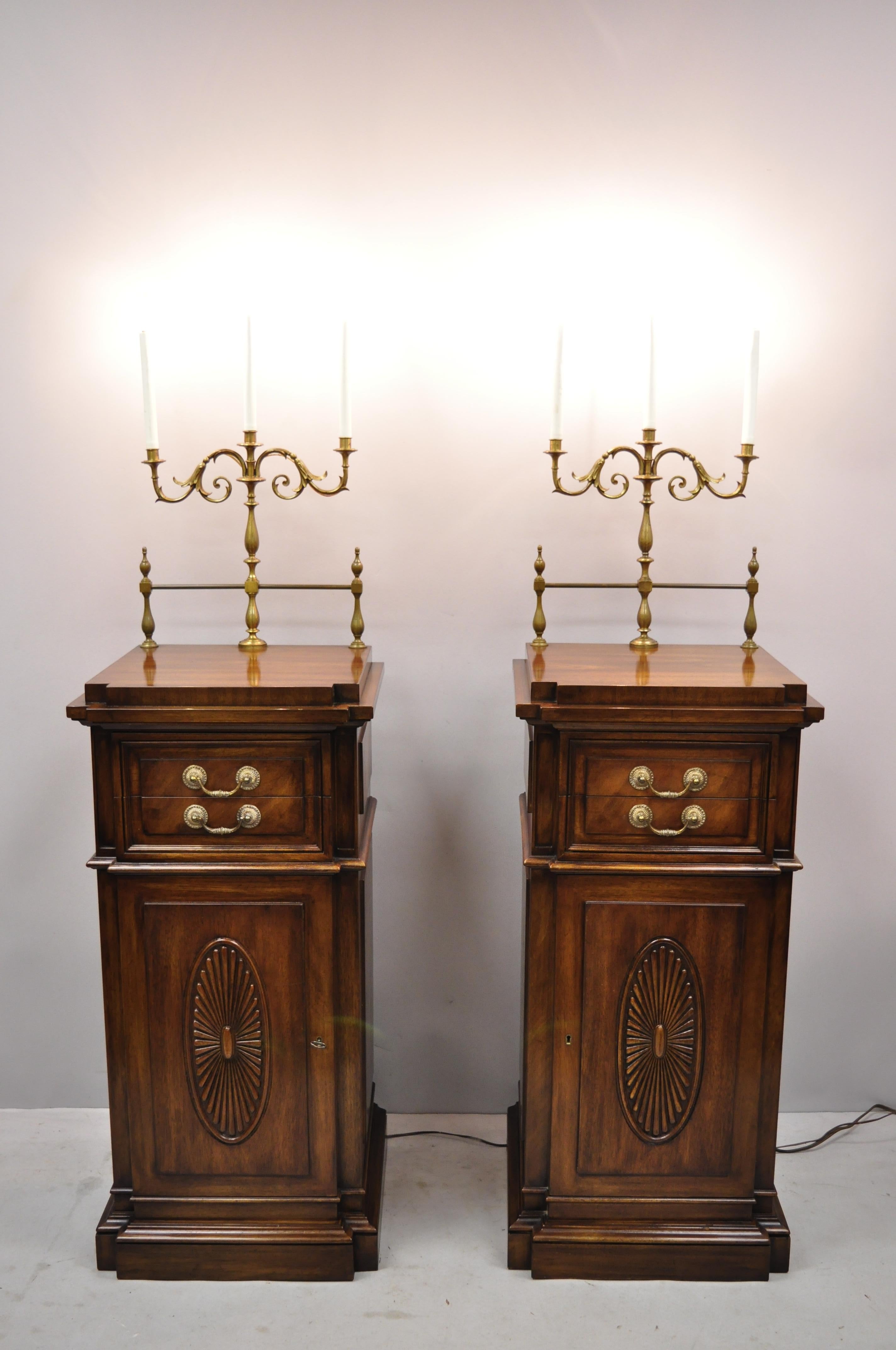 Pair of Karges mahogany tall pedestal side cabinet sideboard with candelabras. Item features electrified brass candelabras, brass gallery, solid wood construction beautiful wood grain, 1 swing door, original label, working lock and key, 2 drawers, 1