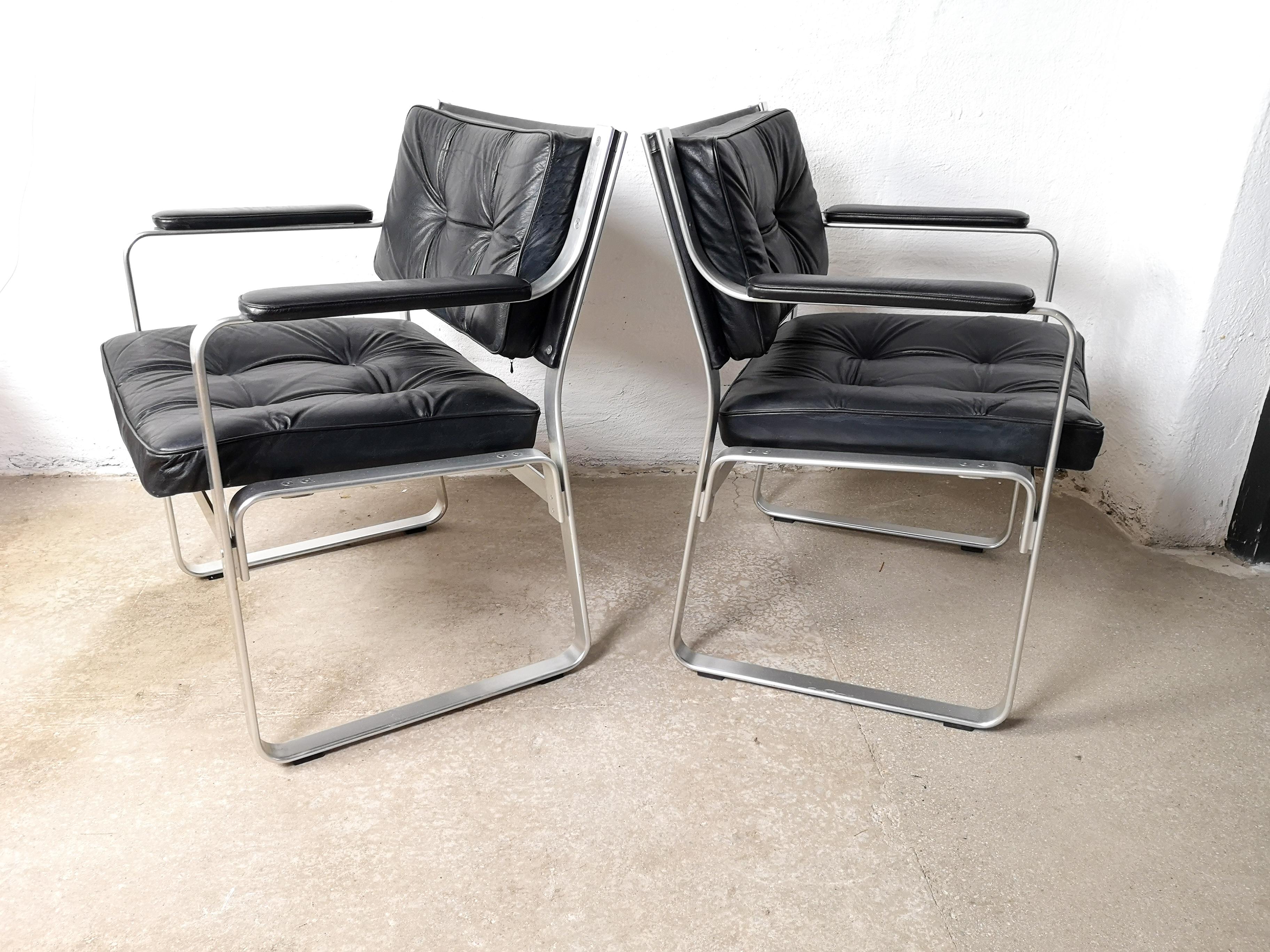 This pair of Mondo armchairs was designed by Karl-Erik Ekselius, (1914-1998) for J.O. Carlsson Mobler Vetlanda, Sweden. It’s made with polished aluminium frames with black leather button tufted seats and backs.

Good vintage condition.

