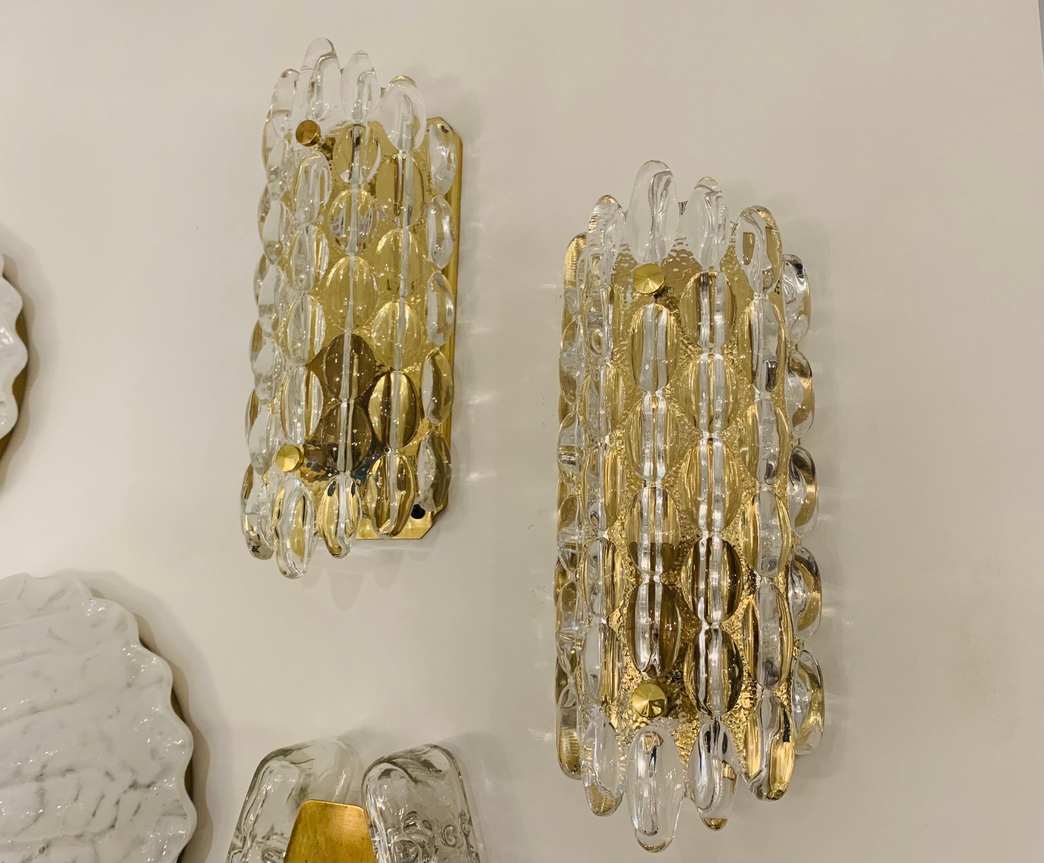 A pair luxurious 1950s thick crystal bubble wall lights designed by Karl Fagerland for Orrefors. Rewired.