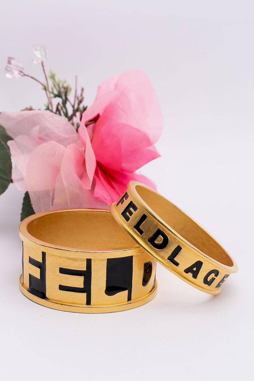 Karl Lagerfeld - Pair of bracelets made of gilted metal and enamel.

Additional information:

Dimensions: 
Circumference: 20 cm (7.87 in) 
Height: 1.5 cm (0.59 in) / 3 cm (1.18 in)

Condition: Very good condition
Seller Ref number: BRA36