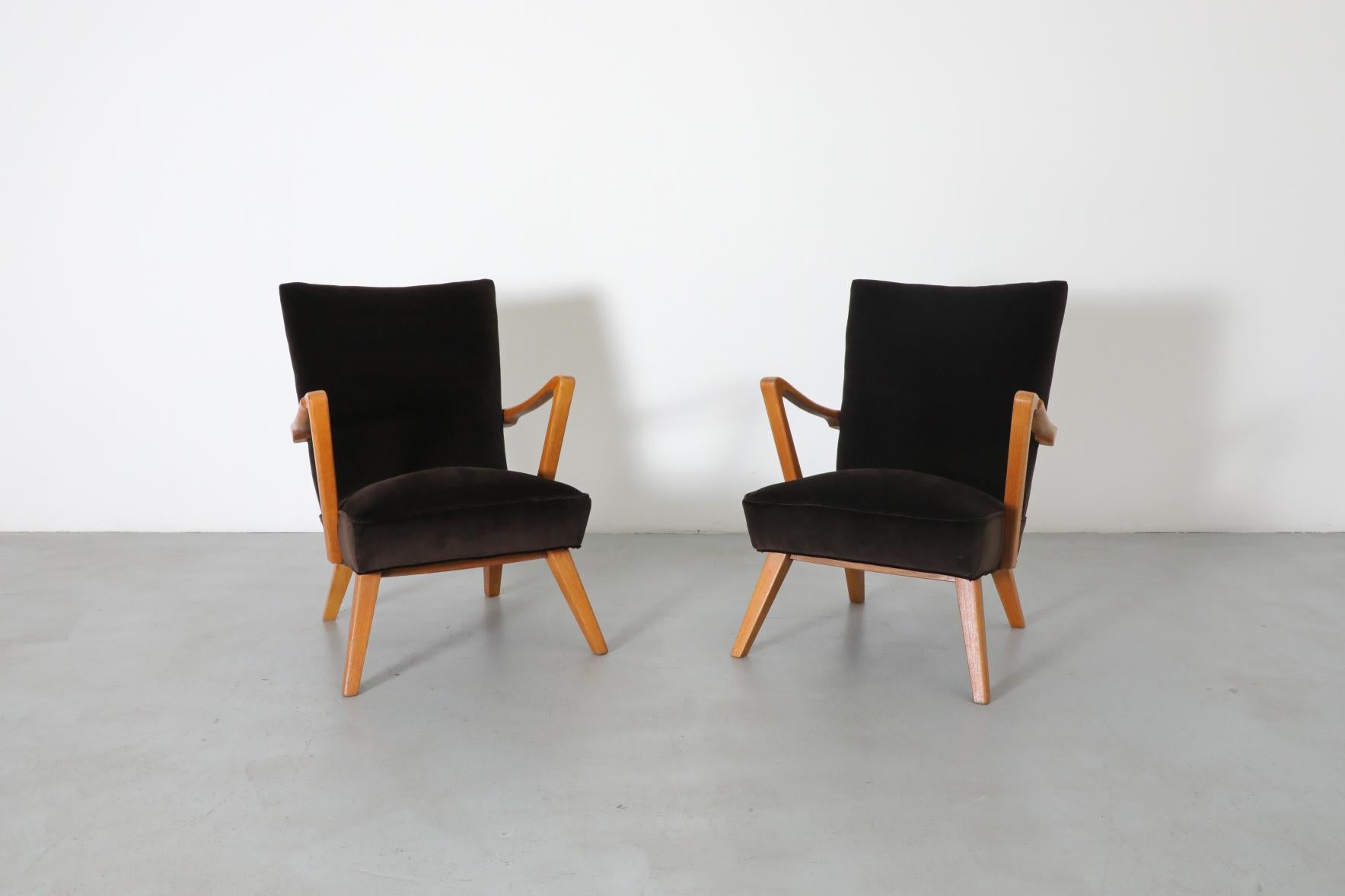 Beautiful, 1950's pair of Danish Karl Nothhelfer style Mid-Century modern easy chairs with lightly refinished oak frames and new cafe velvet upholstery. In original condition with wear consistent with age and use. Set price.