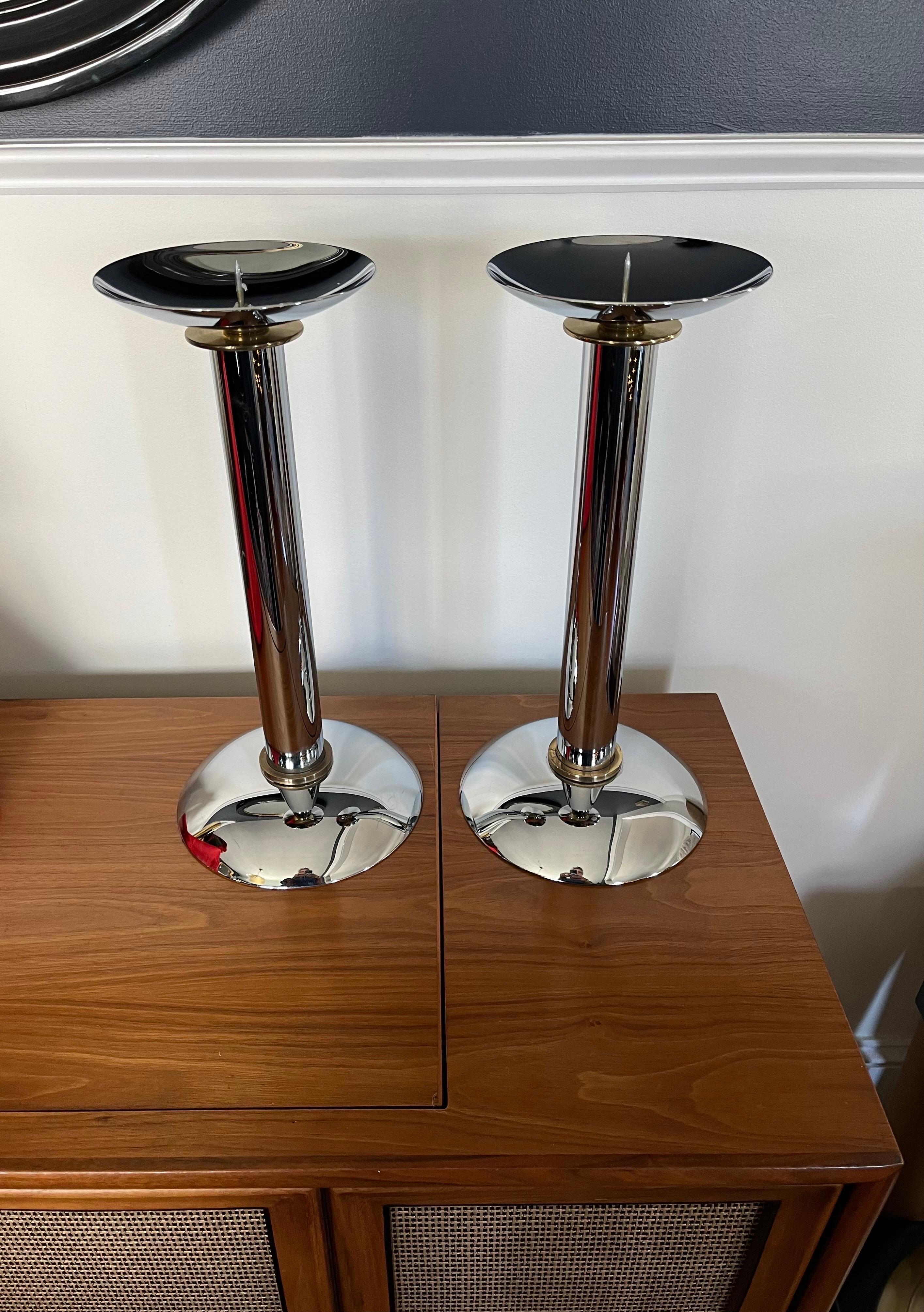 A rare pair of chrome and brass candlestick holders / candelabras by influential, important & renowned 20th Century German born American designer Karl Springer, circa 1985. Beautiful dimensions - large and oversized proportions.
Curbside to