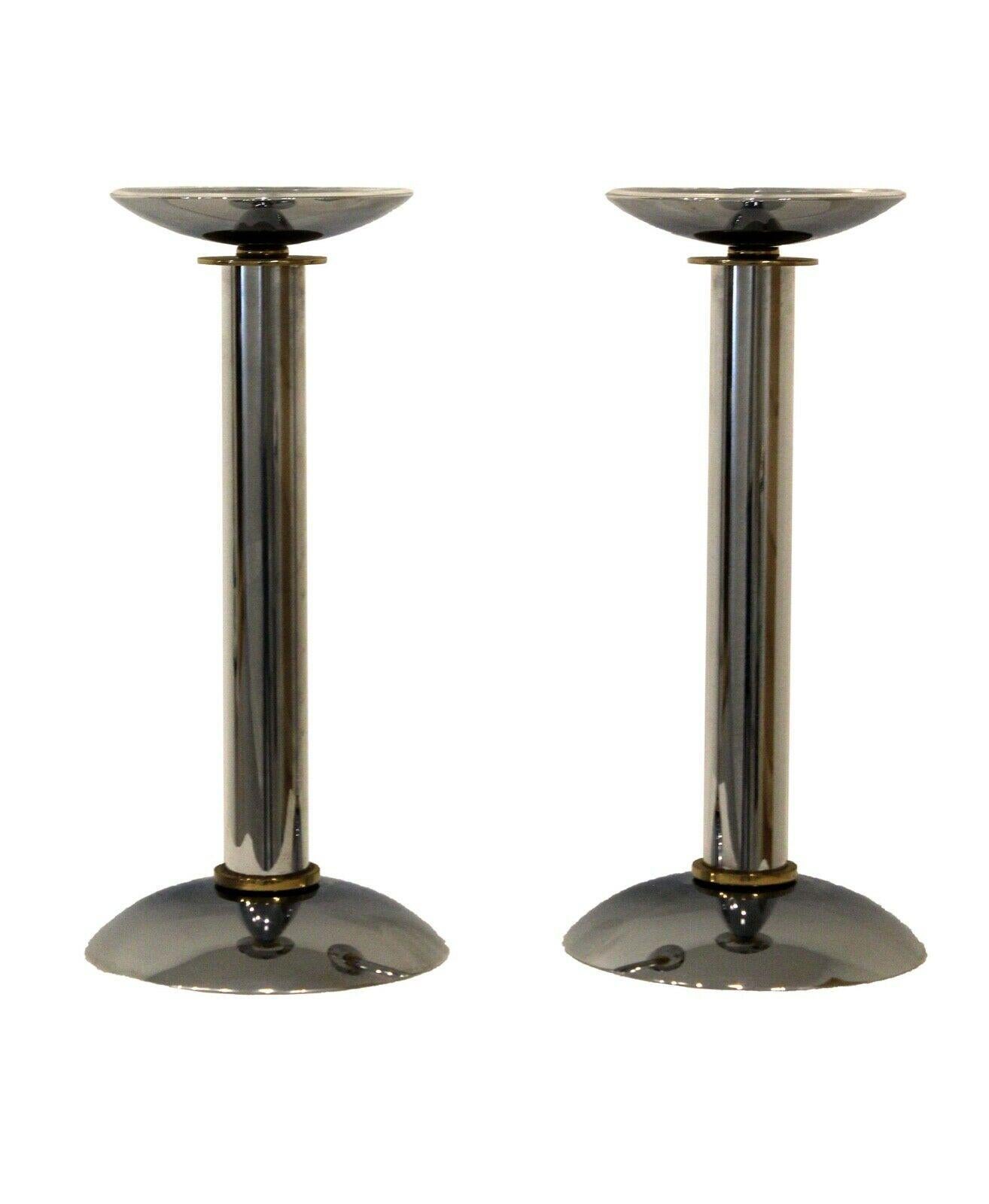 From Le Shoppe Too in Michigan comes this pair of highly polished chrome and brass set of two candle holders from Karl Springer, a foremost name in postmodern design. In very good condition.
 