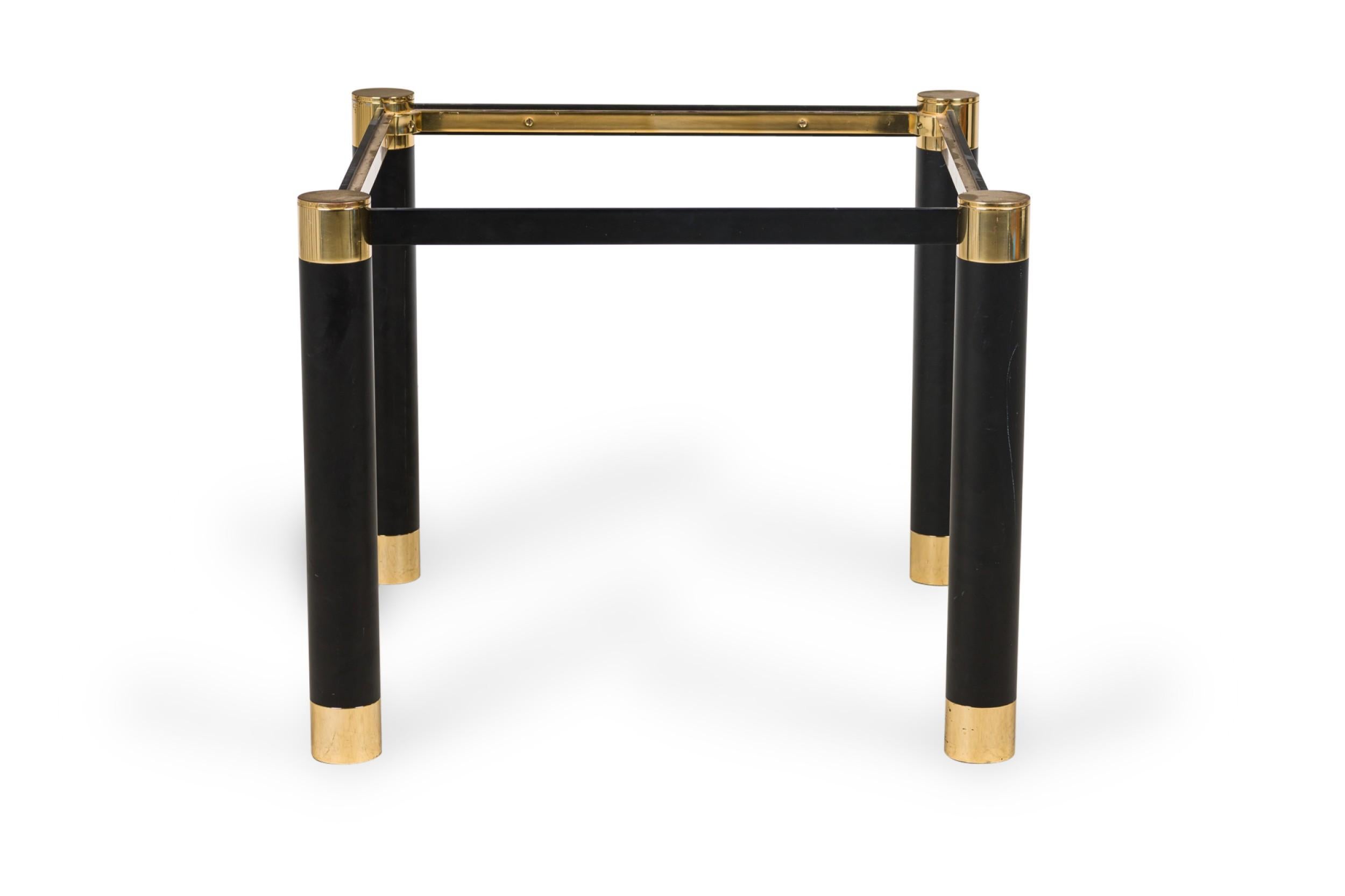 PAIR of Mid-Century American Modern (1970s) square form end / side table frames comprised of 4 cylindrical ebonized metal legs with brass caps and anchored by 4 horizontal ebonized metal stretchers. (KARL SPRINGER) (PRICED AS PAIR)

Condition: Good;