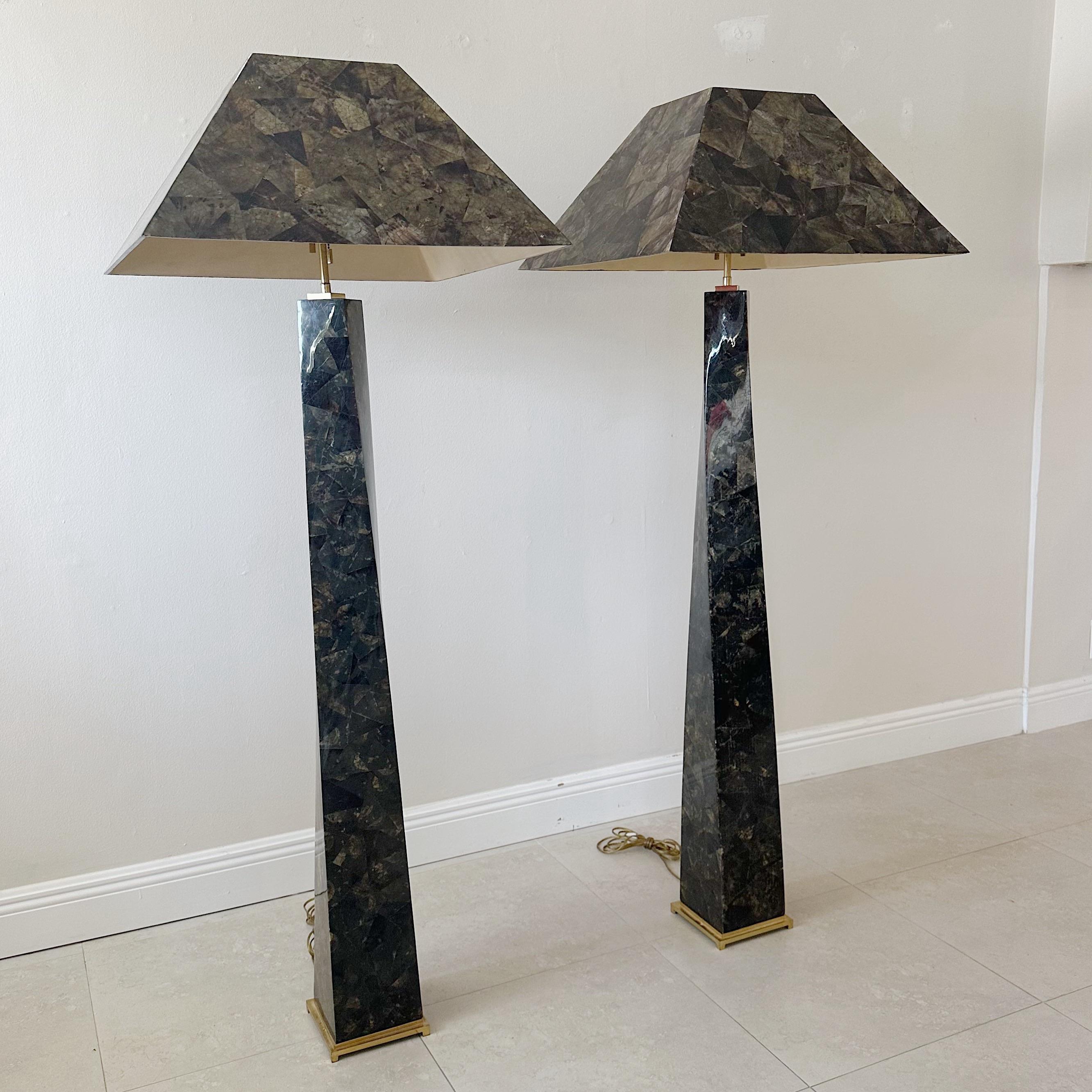 Pair of Karl Springer floor lamps that twist from the base after Jean-Michel Frank from the 1980s. Tessellated penshell on twist columns and shades. Brass base and fittings. Adjustable finial. Original wiring. Base measures 7