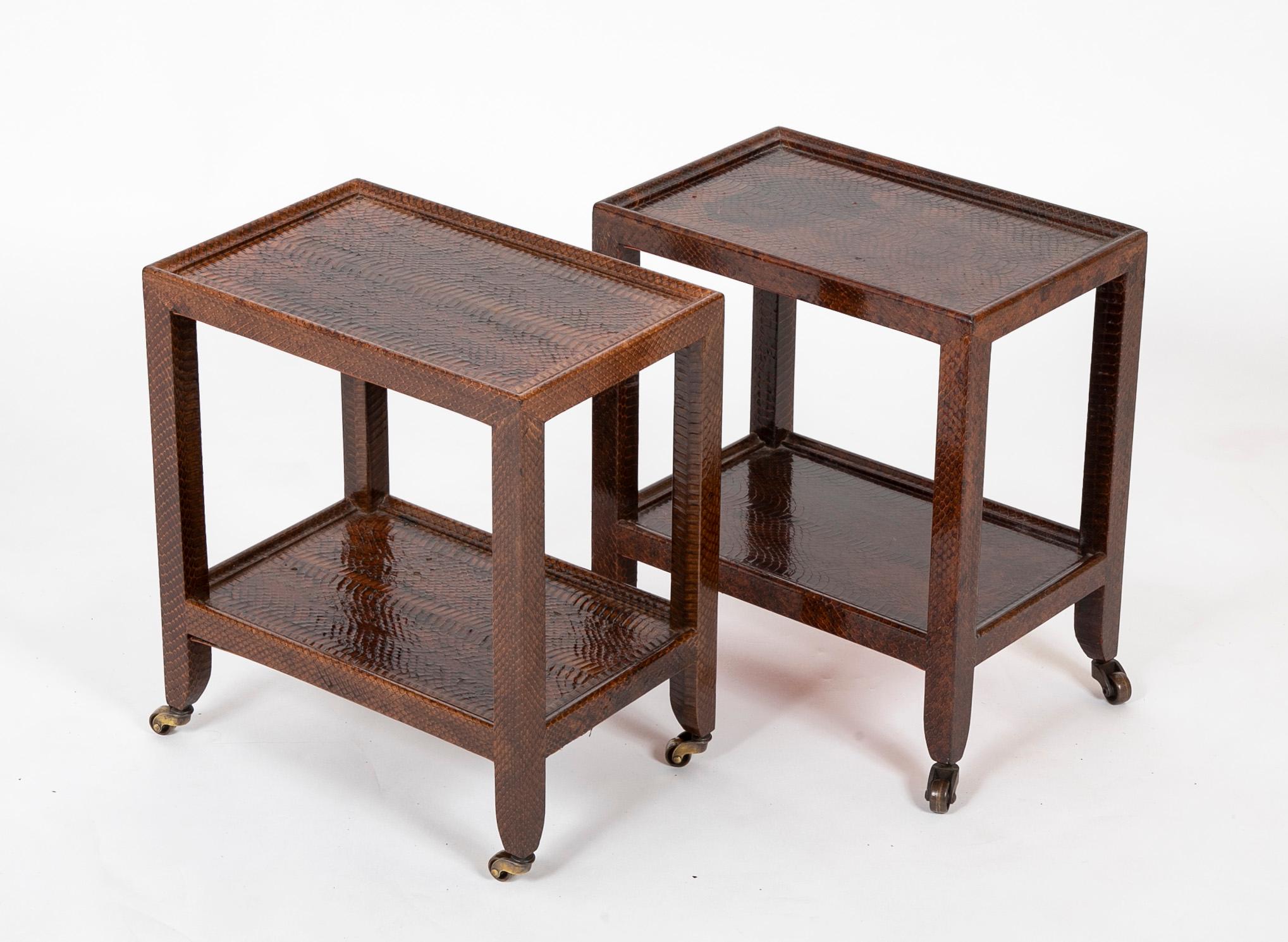 Pair of Karl Springer snake skin two-tier side tables. One with embossed leather label 