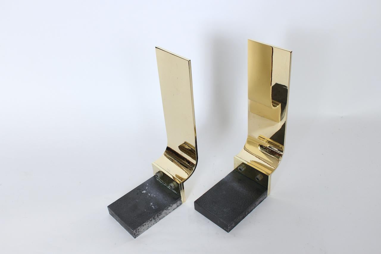 Mid-20th Century Pair of Karl Springer Style Polished Brass & Block Cast Iron Andirons, C. 1960 For Sale