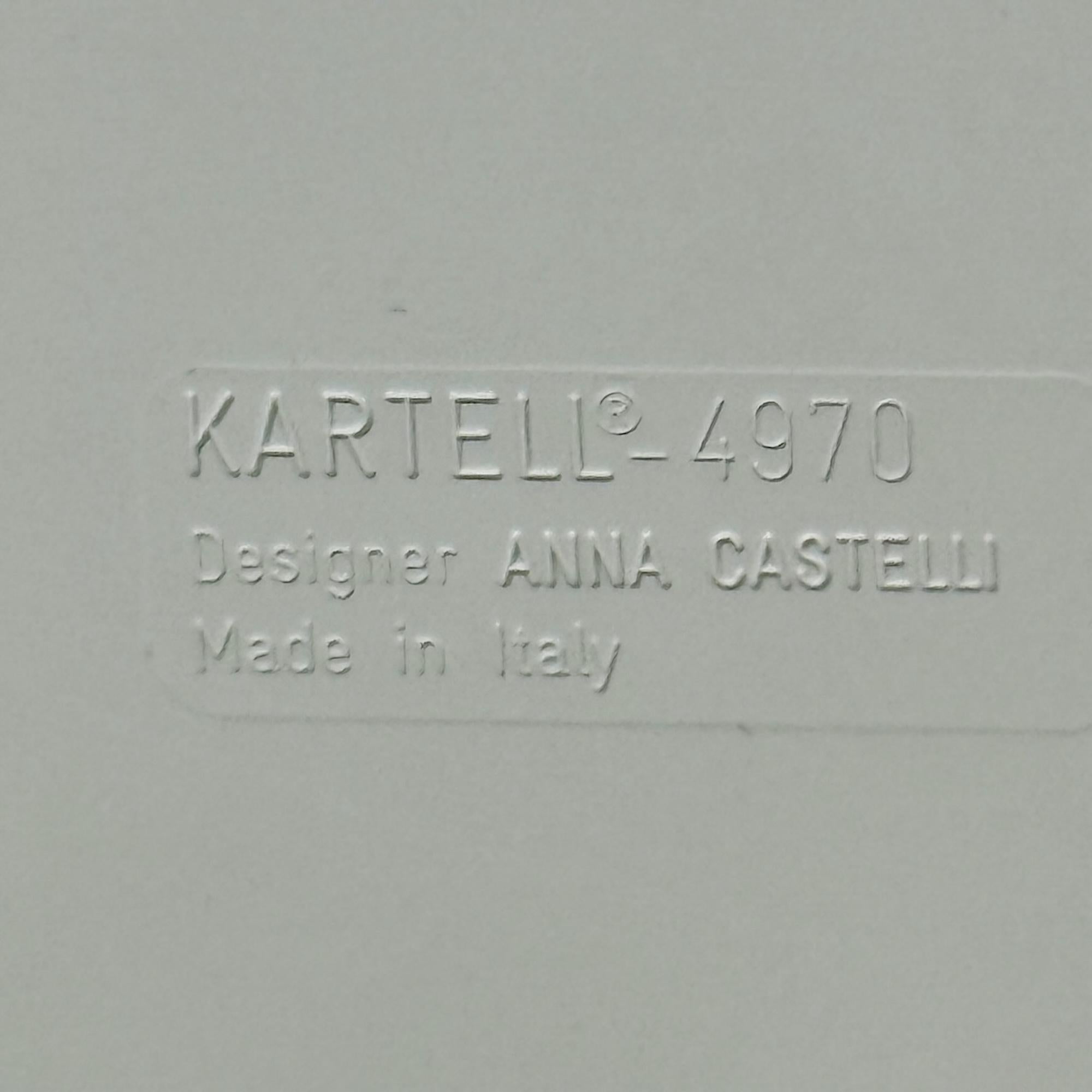 Rare Vintage Kartell Componibili Set from the 1960s featuring four square-based modular elements in creamy off-white ABS plastic.

The lot includes two tops and two sets of four wheels (one compatible only with a single element), allowing for