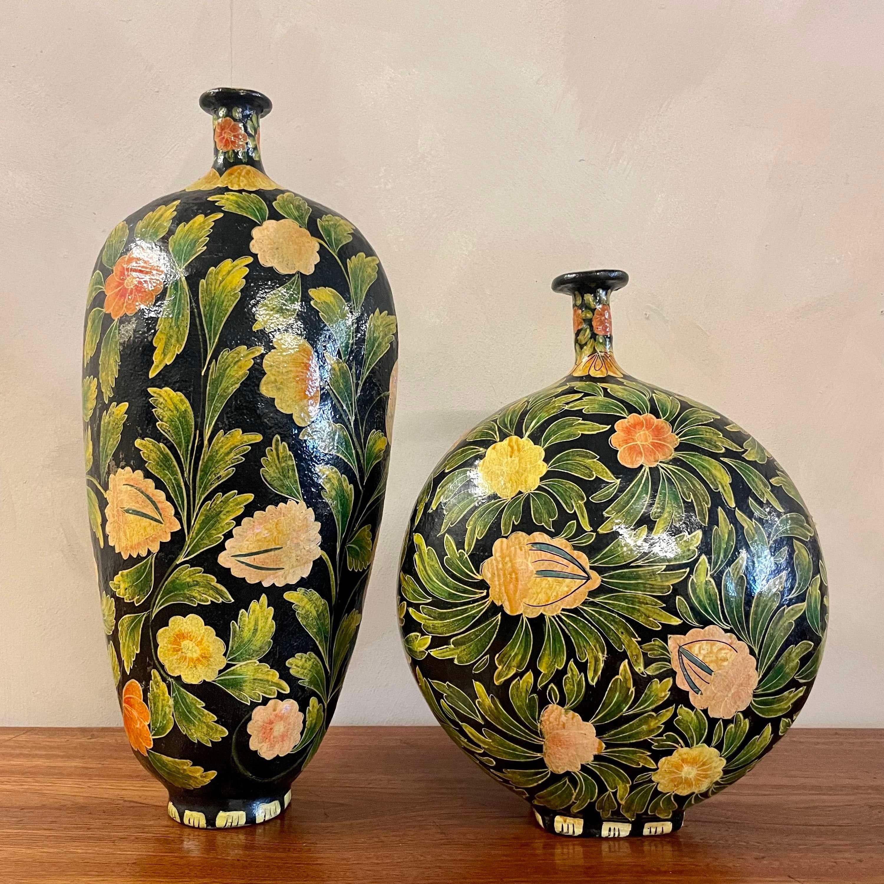 Pair of large Kashmiri hand painted floral paper mache and velum vases.
Hand painted, Early 20th Century.
These vases would have been re painted over time, due to weather conditions in India affecting the colourtion of the pieces on the markets