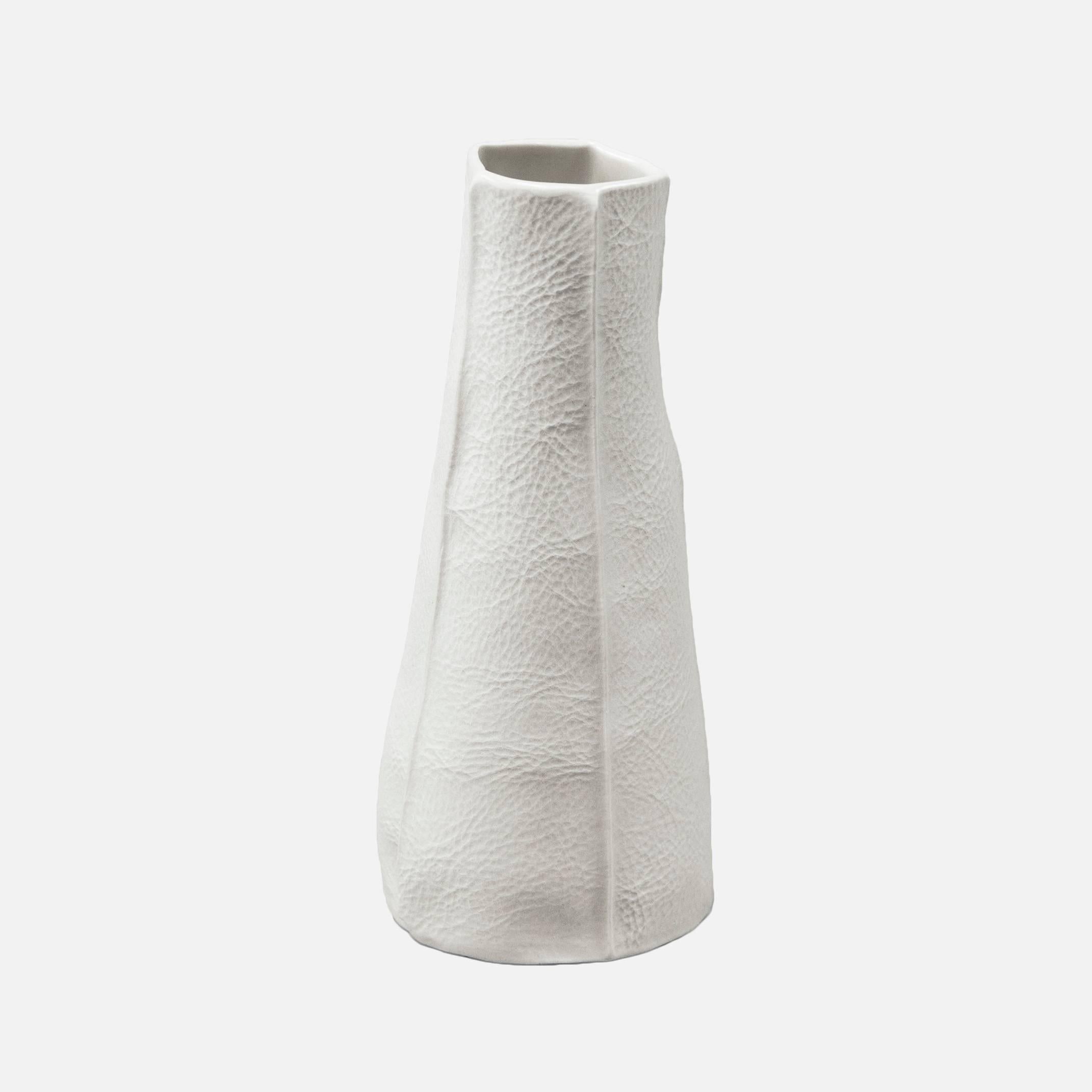 This pair of Kawa vases includes two pieces handcrafted by the designer (and Souda's Co-Owner), Luft Tanaka. The price is for both vases. Each pair vases is made to order with a process that involves casting liquid porcelain into a mold that's made
