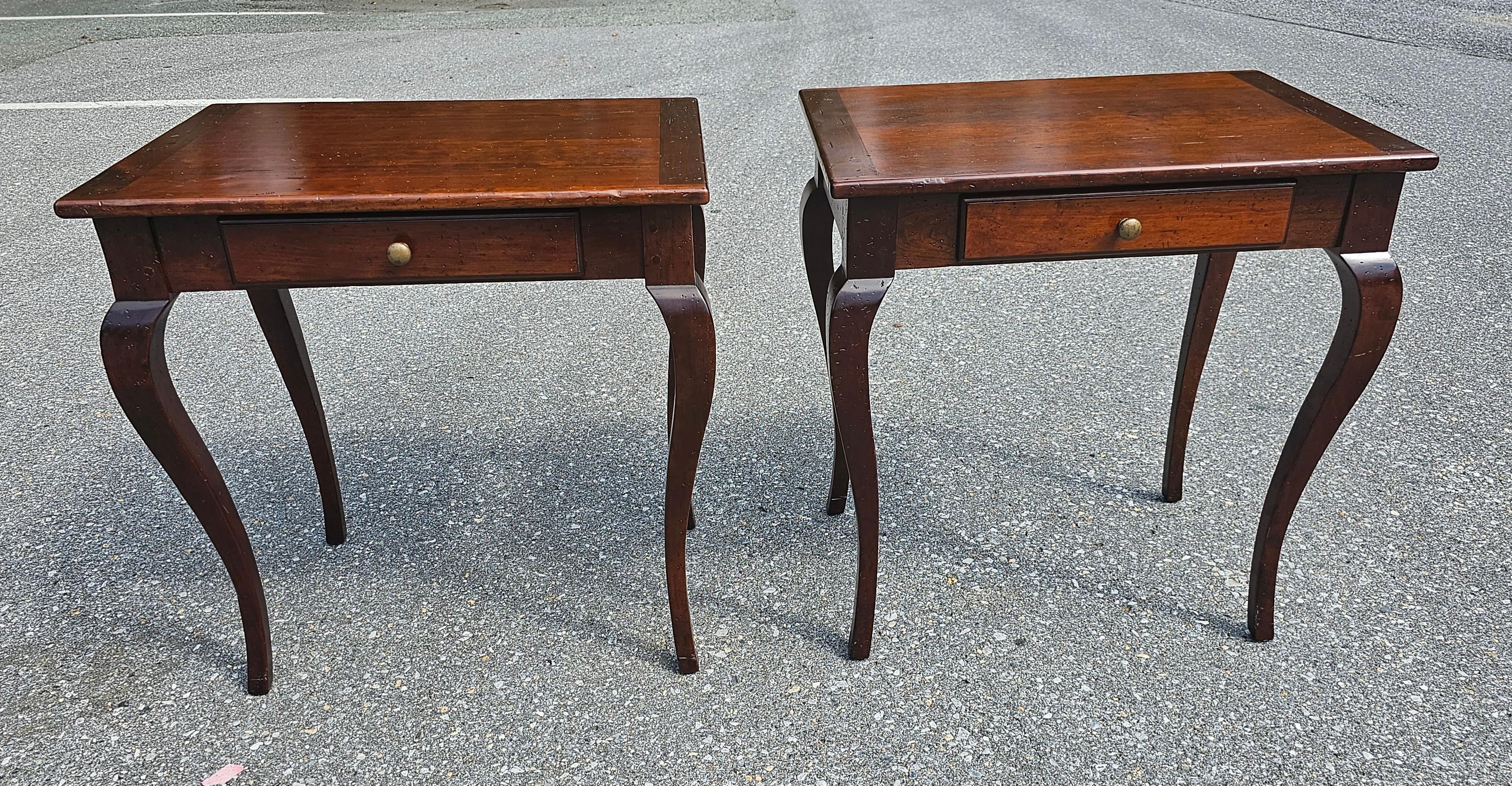 An exquisite pair of Kellogg Collection distressed walnut single drawer side tables in excellent condition. Fully Finished inside out. Measures 25