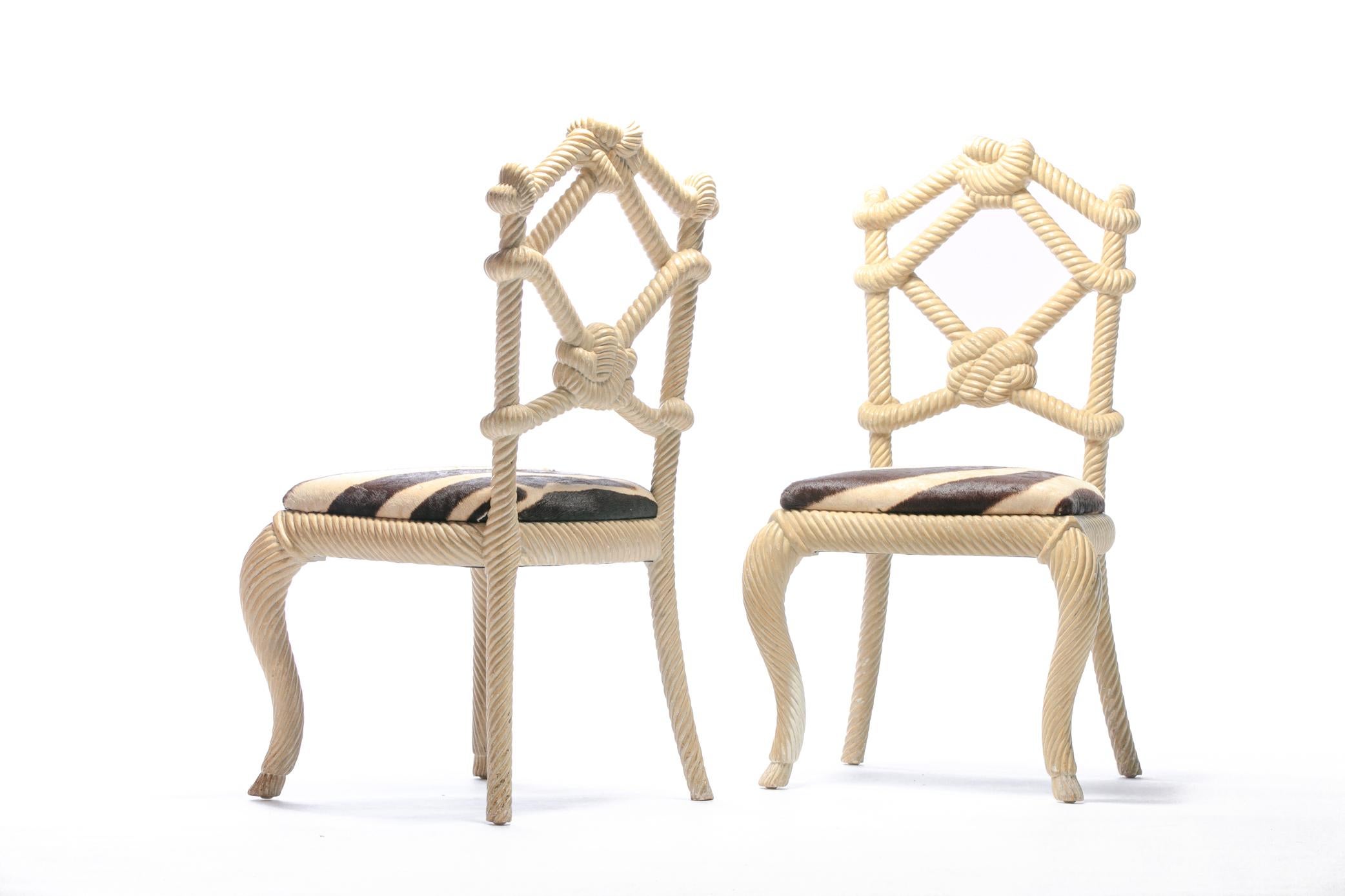 Whimsy and fantasy unite in this stunning pair of carved wood nautical rope form chairs freshly reupholstered in zebra hide. These rope chairs were selected by Interior Designer Kelly Wearstler for her project - Viceroy Miami, circa 2008. High