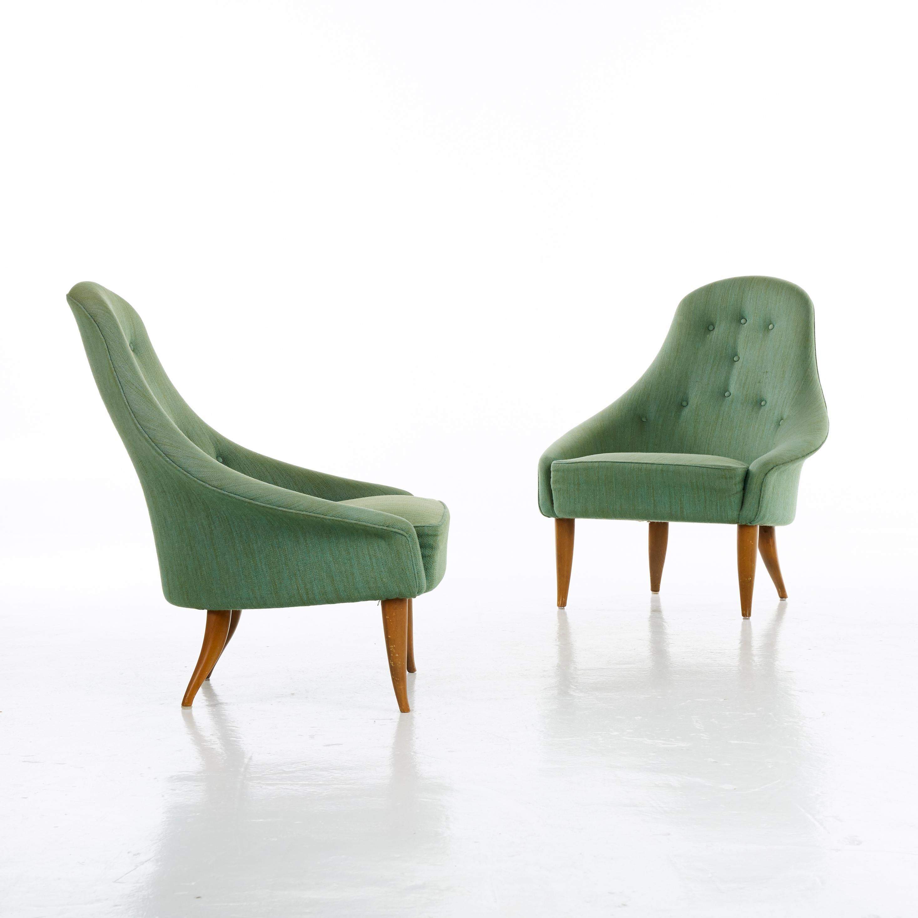 A pair of Kerstin Horlin Holmqvist (Holmquist) Lilla Eva armchairs for Nordiska Kompaniet (NK), Sweden, 1950s. Original green fabric. In good vintage condition - minor signs or use and wear relative to age. We offer a re-upholstery service for these