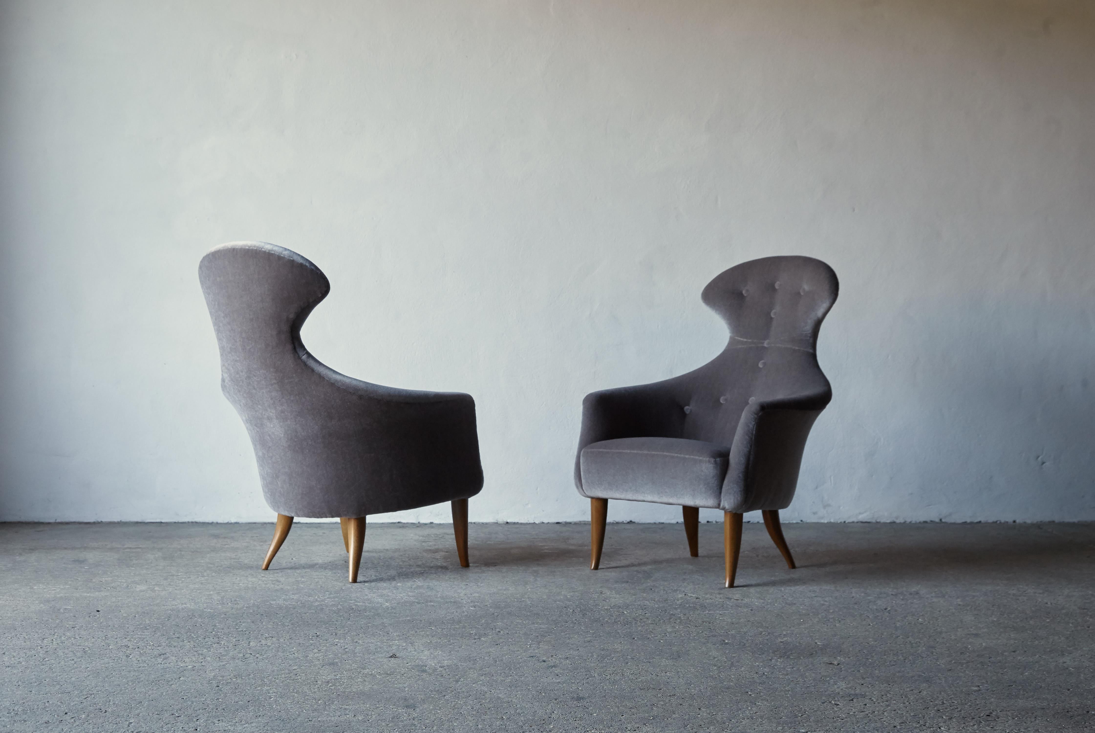 A pair of Kerstin Horlin Holmquist Stora Eva chairs, newly upholstered in premium pure mohair fabric,  designed in 1958 and produced by Nordiska Kompaniet (NK) as part of the Triva series in Sweden.   Fast shipping worldwide.

