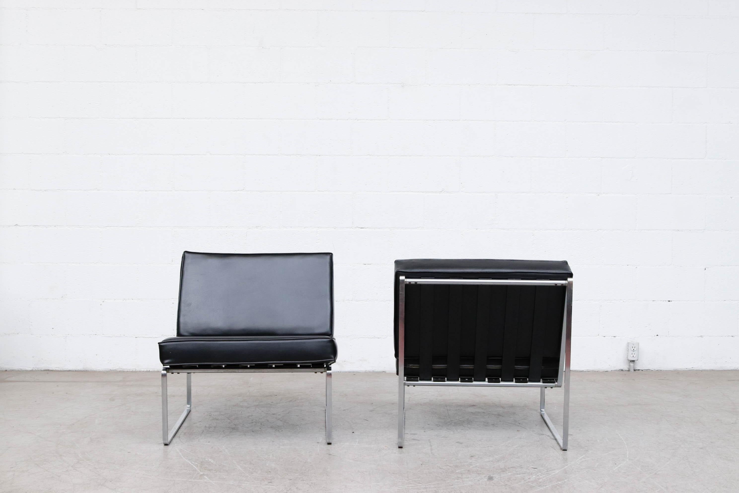 Pair of Kho Liang Ie Model 025 lounge chairs for Artifort, Holland. Chrome frame with black stained wood Slats and Skai upholstered cushions in original condition. Set price.