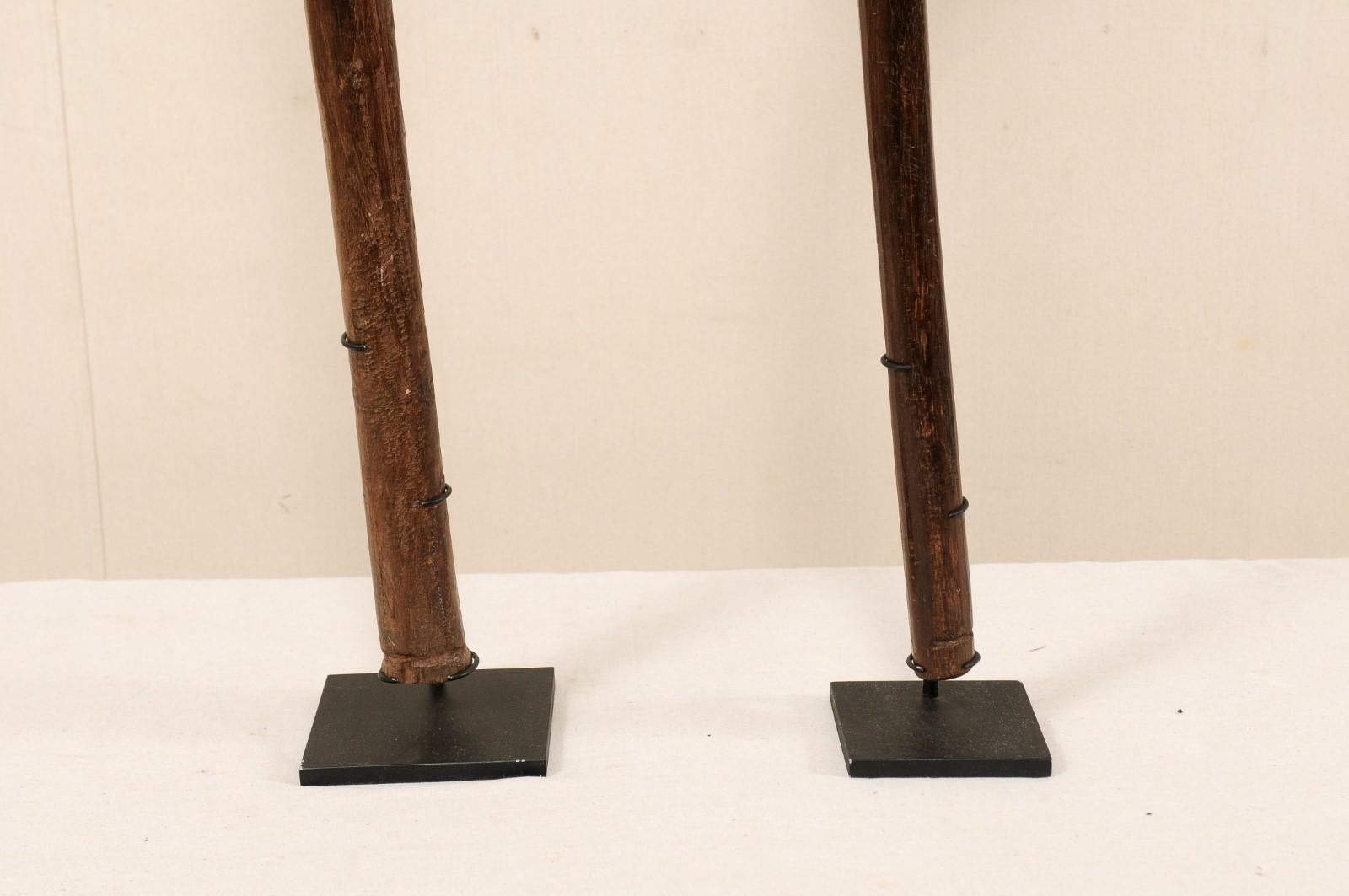 Metal Pair of Kiakavo Wooden Clubs from the Fiji Islands on Custom Black Stands For Sale