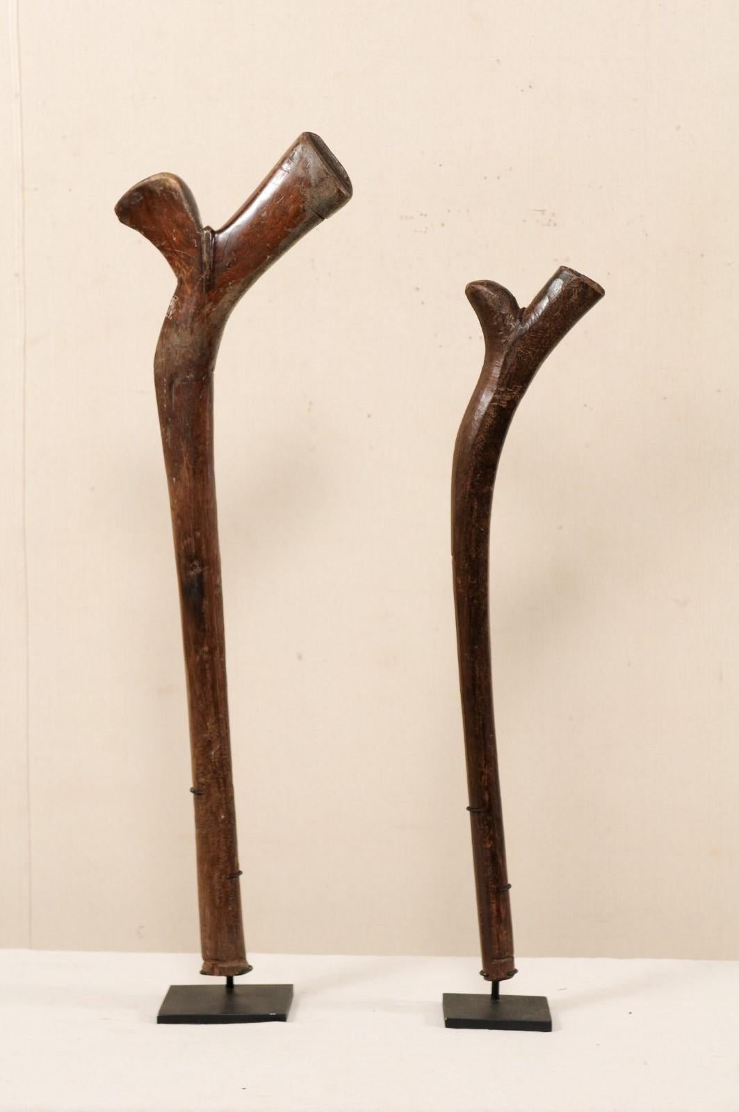 Hand-Carved Pair of Kiakavo Wooden Clubs from the Fiji Islands on Custom Black Stands For Sale