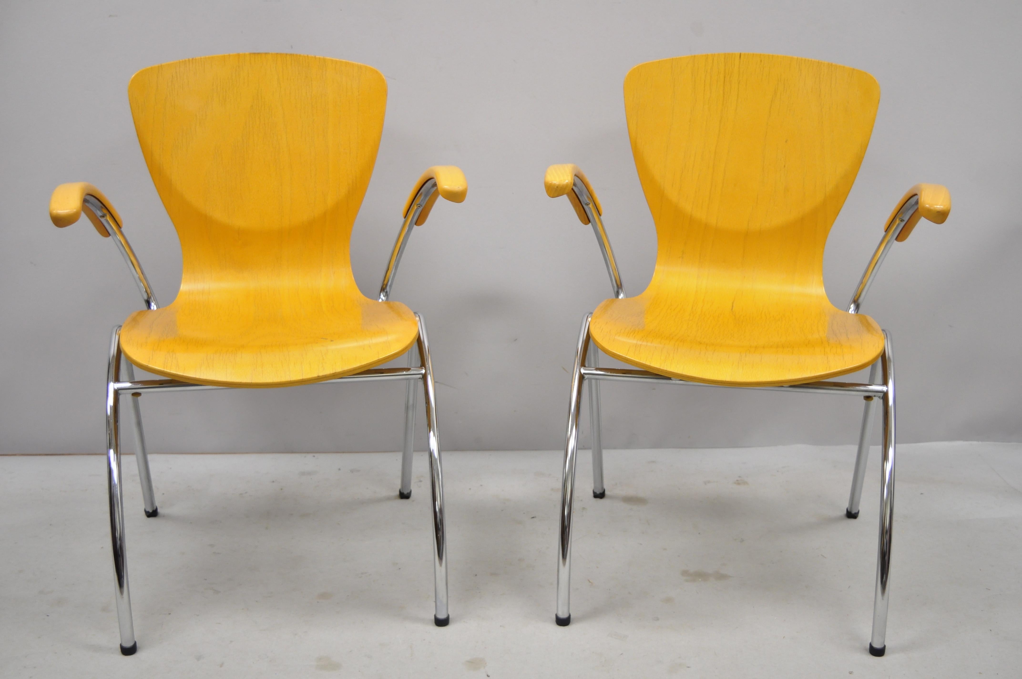 Pair of Kimball Bingo stacking armchairs midcentury Danish modern style. Listing includes Bentwood seats, stacking form, beautiful wood grain, metal frame, original label, sleek sculptural form, circa 2004. Measurements: 33