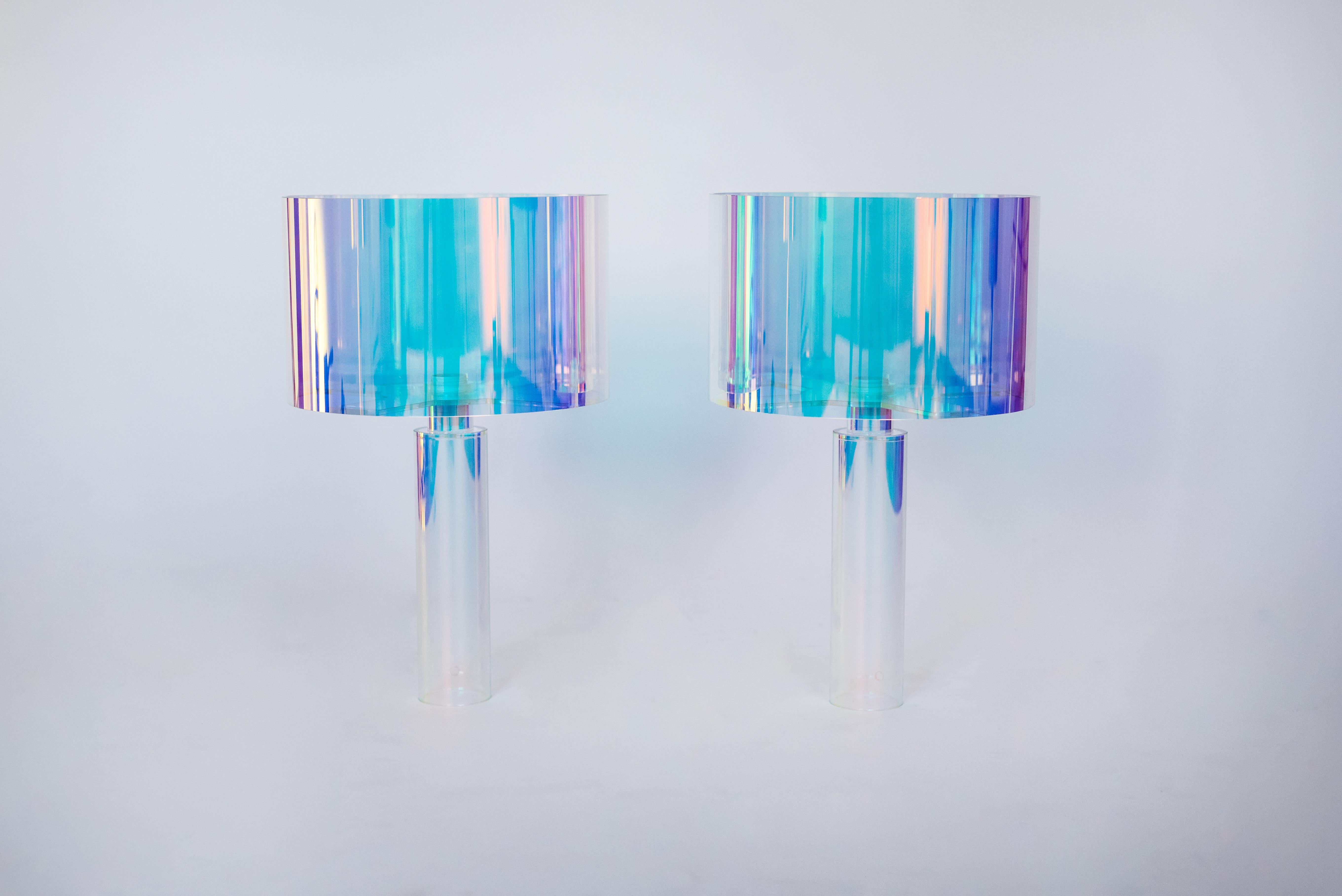Pair of kinetic colors table lamps by Brajak Vitberg
Plexiglass + dichroic film
Dimensions: 55 x 35 x 35 cm
white or black cotton lampshade, cotton wiring


Bijelic and Brajak are two architects from Ljubljana, Slovenia.
They are striving to
