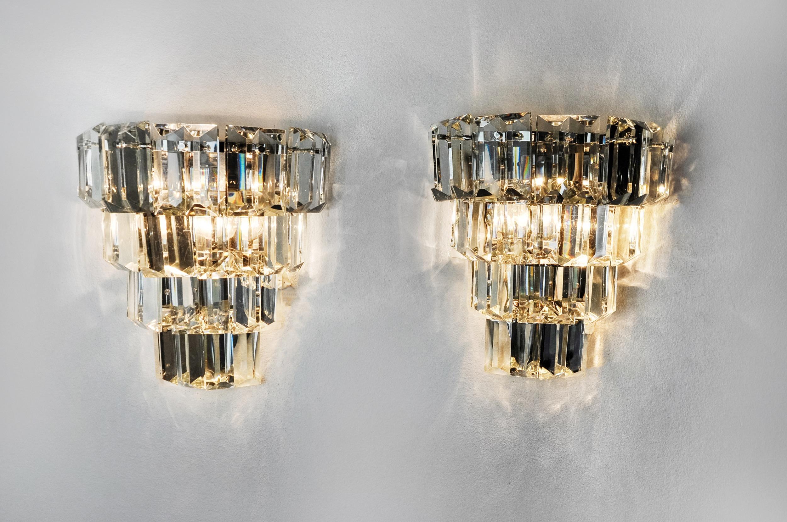 Very beautiful and large pair of Kinkeldey wall lights designed and produced in Germany in the 1970s. Cut crystals distributed over 4 levels of a chrome metal structure. Rare design object that will illuminate your interior wonderfully. Electricity