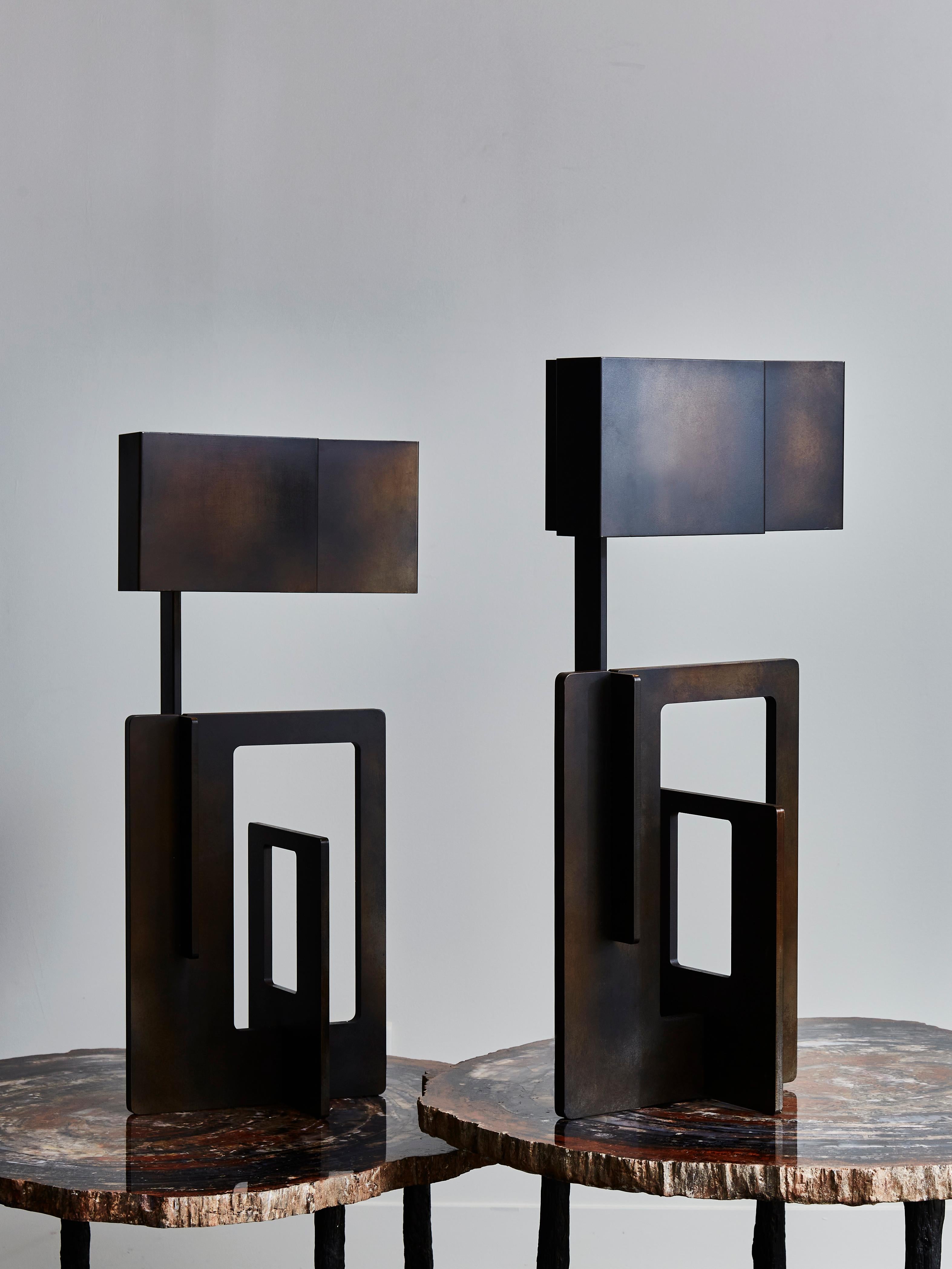 Pair of sculptural and geometric table lamps designed and made by Esperia in waxed iron finish with matching shades.