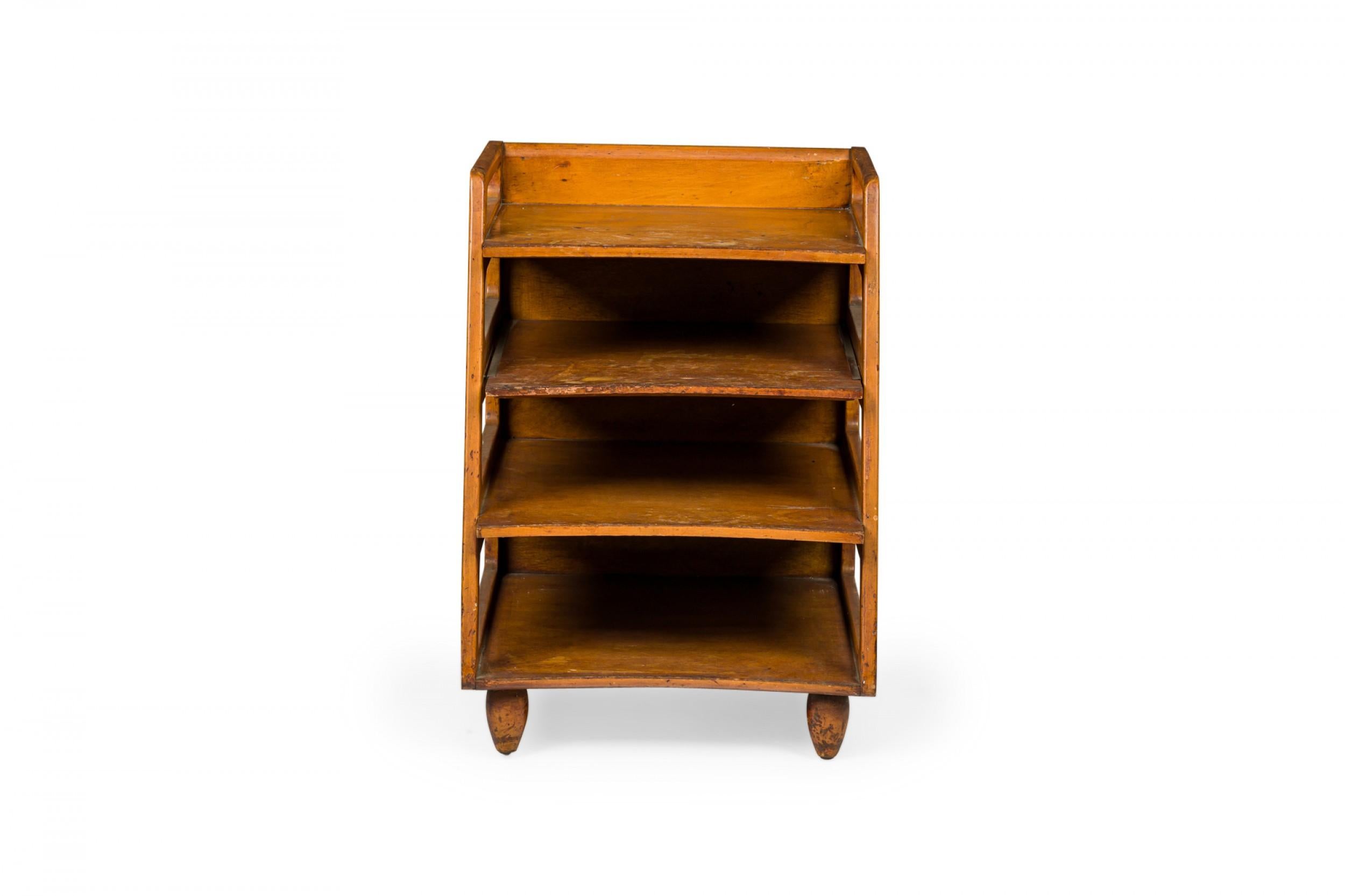 PAIR of American Mid-Century wooden magazine tables with square top surrounded on three sides with shallow galleries open on two sides above three lower compartments with curved shelf fronts. (KITTINGER FURNITURE COMPANY)(PRICED AS PAIR)
