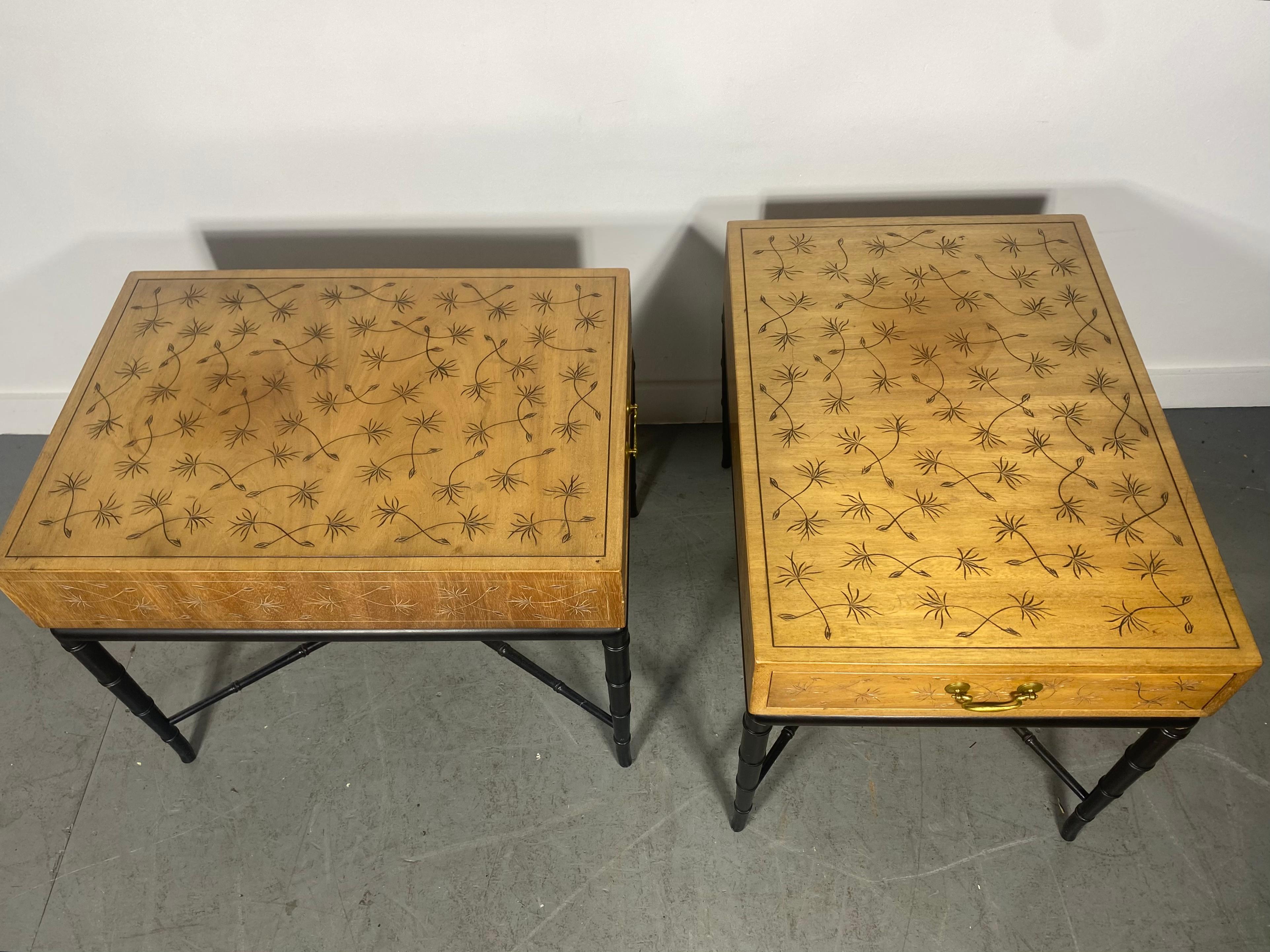 PAIR of Hollywood Regency-style (1950s) end / side tables with a walnut top section with an incised dandelion design and a single drawer with a brass drawer pull, resting on a black lacquered faux bamboo base with four tapered legs and an x-shaped