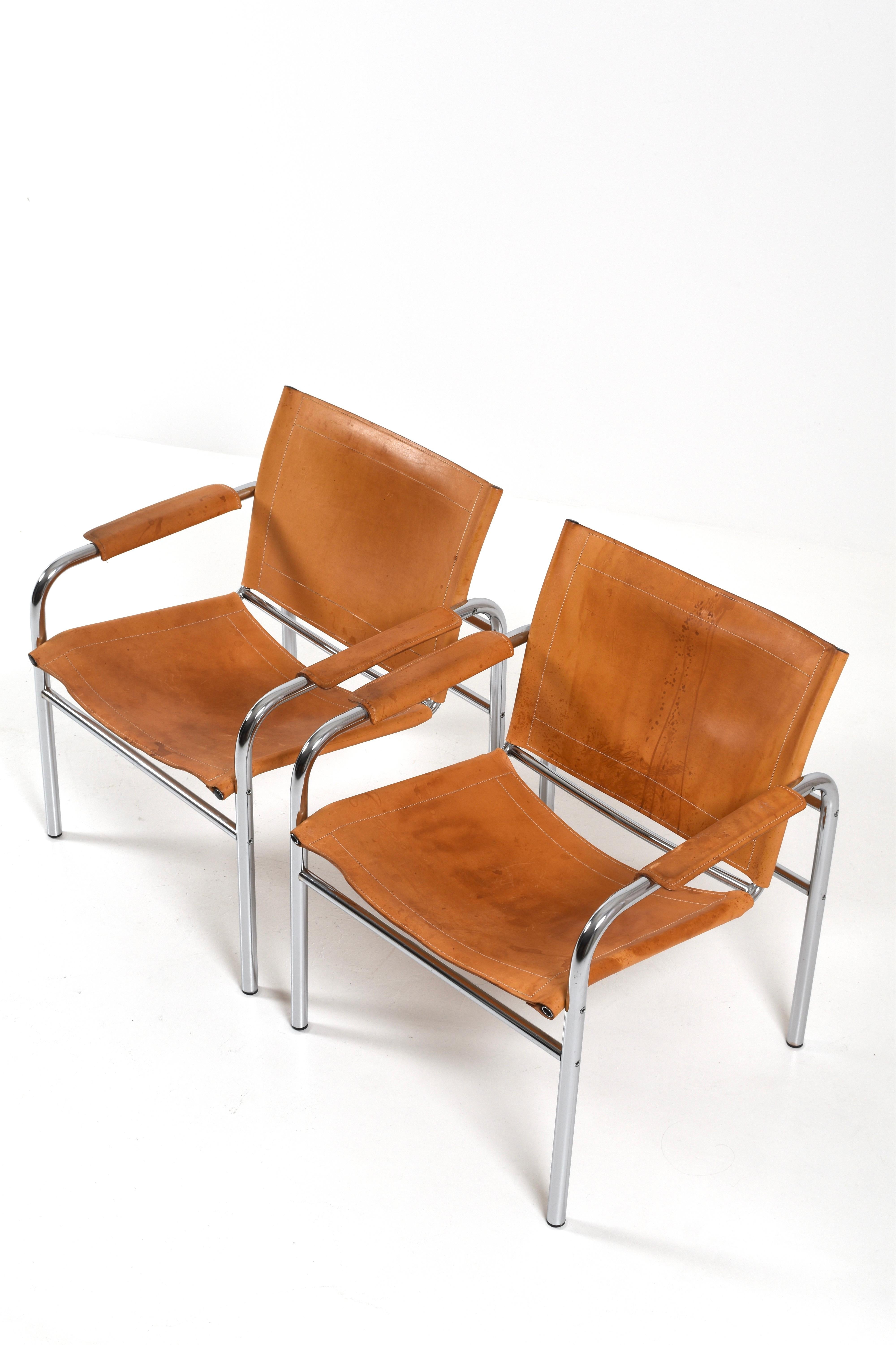 A pair of “Klinte” easy chairs by Swedish designer Tord Björklund embodies the clean lines and refined materiality that define late 20th-century Scandinavian design. Produced in Sweden during the 1980s, each chair features a minimalist tubular steel
