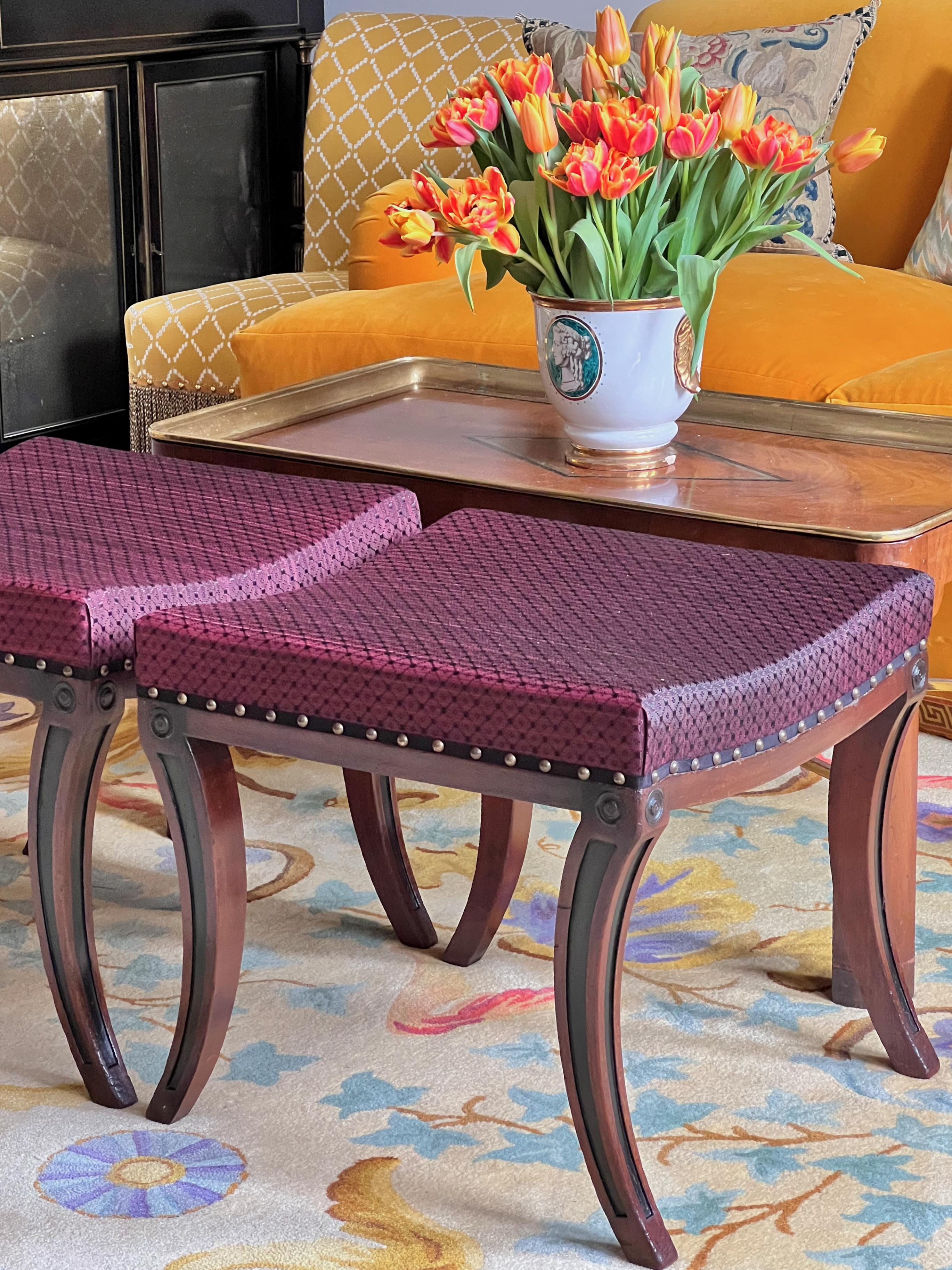 A pair of Regency style 'Klismos' stools or benches, upholstered in John Boyd Textiles horsehair fabric.

Why we like them
These super smart Klismos stools are inspired by ancient Greek examples, often found depicted on Attic and Apulian pottery and
