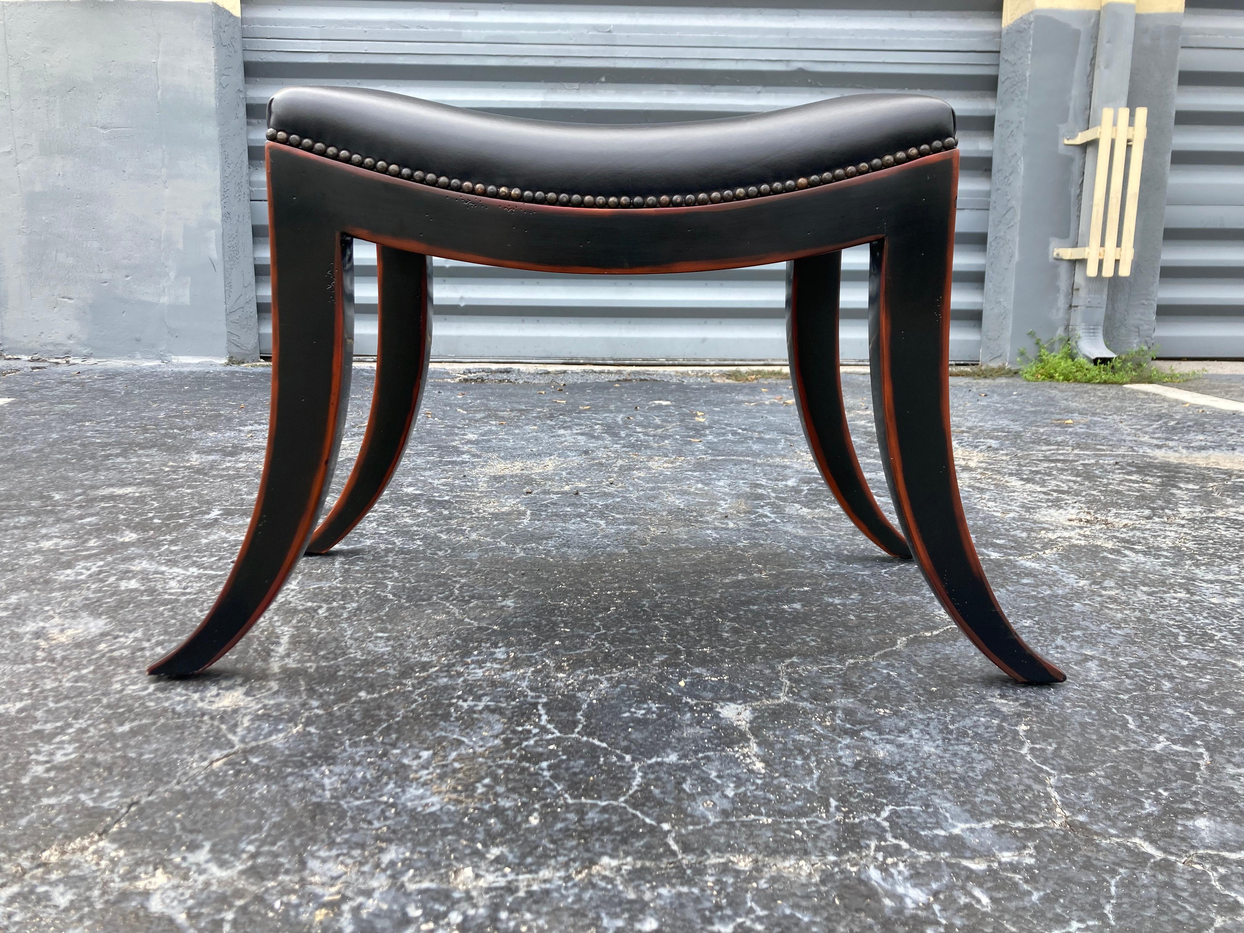 Pair Klismos Stools, black leather. Sold by Theodore Alexander. Width is measured from bottom of legs.
