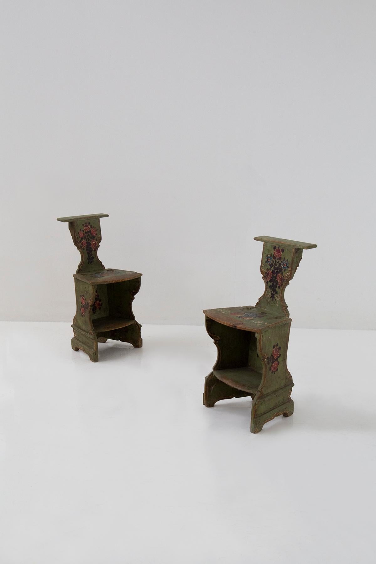 A pair of antique chairs, created from walnut wood with a polychrome technique, honours us with its presence, testimony to a bygone era. Admire their majesty, for they date back to the late 1700s and their age is engraved on the seat in ancient