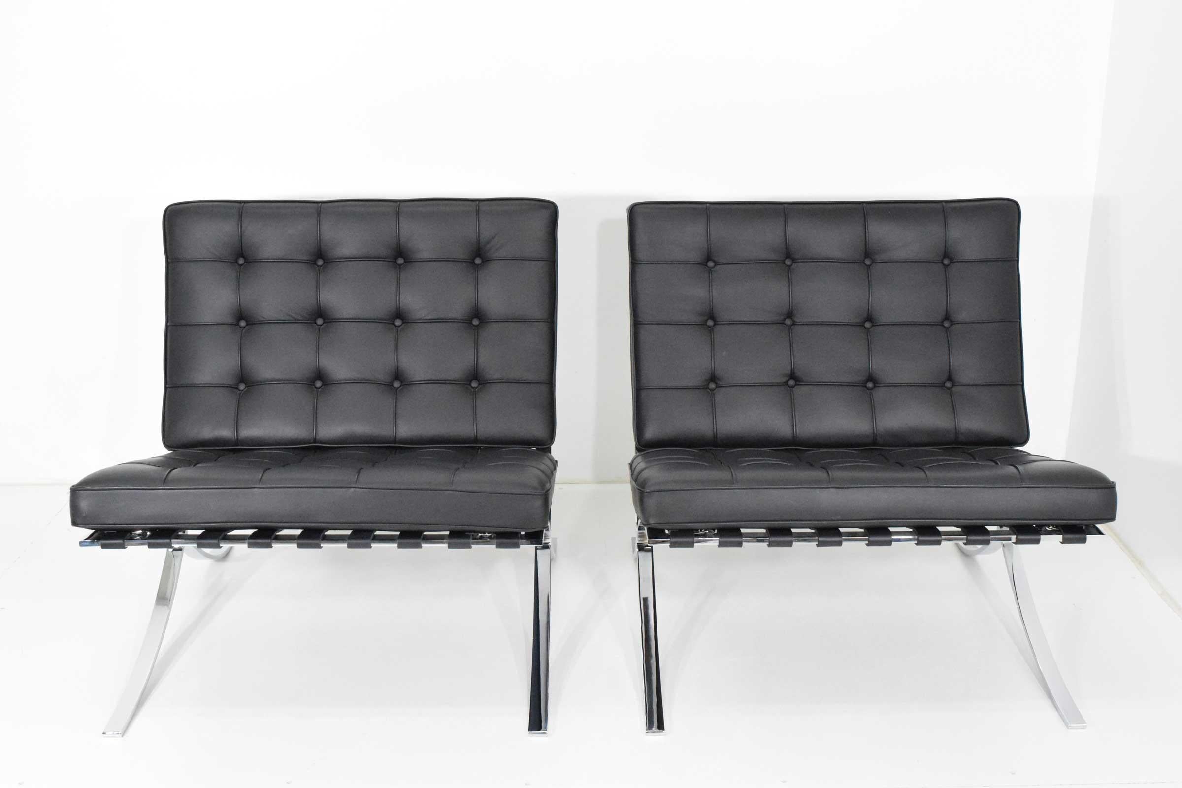 Like new pair of Knoll Barcelona chairs designed by Mies van der Rohe. Stamped with Knoll Studio stamp in each leg. Chairs are in great condition. Black leather.