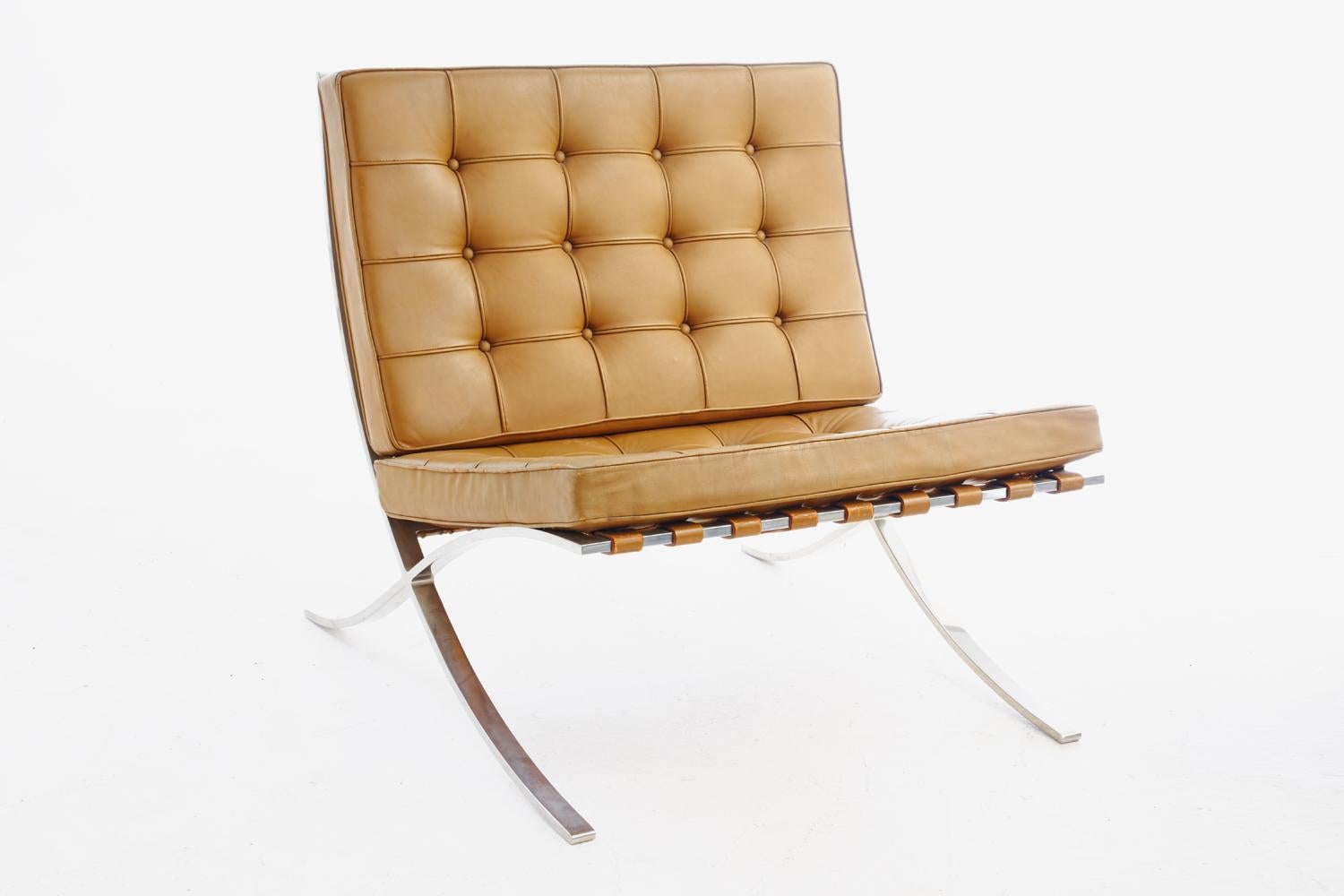 Stunning pair of Barcelona chairs manufactured by Knoll, 1960s designed by Mies van der Rohe, Classic design, original hand-sewn tan leather seat and back cushions, wonderful patina, retain original early Knoll Associates label.Hand delivery avail