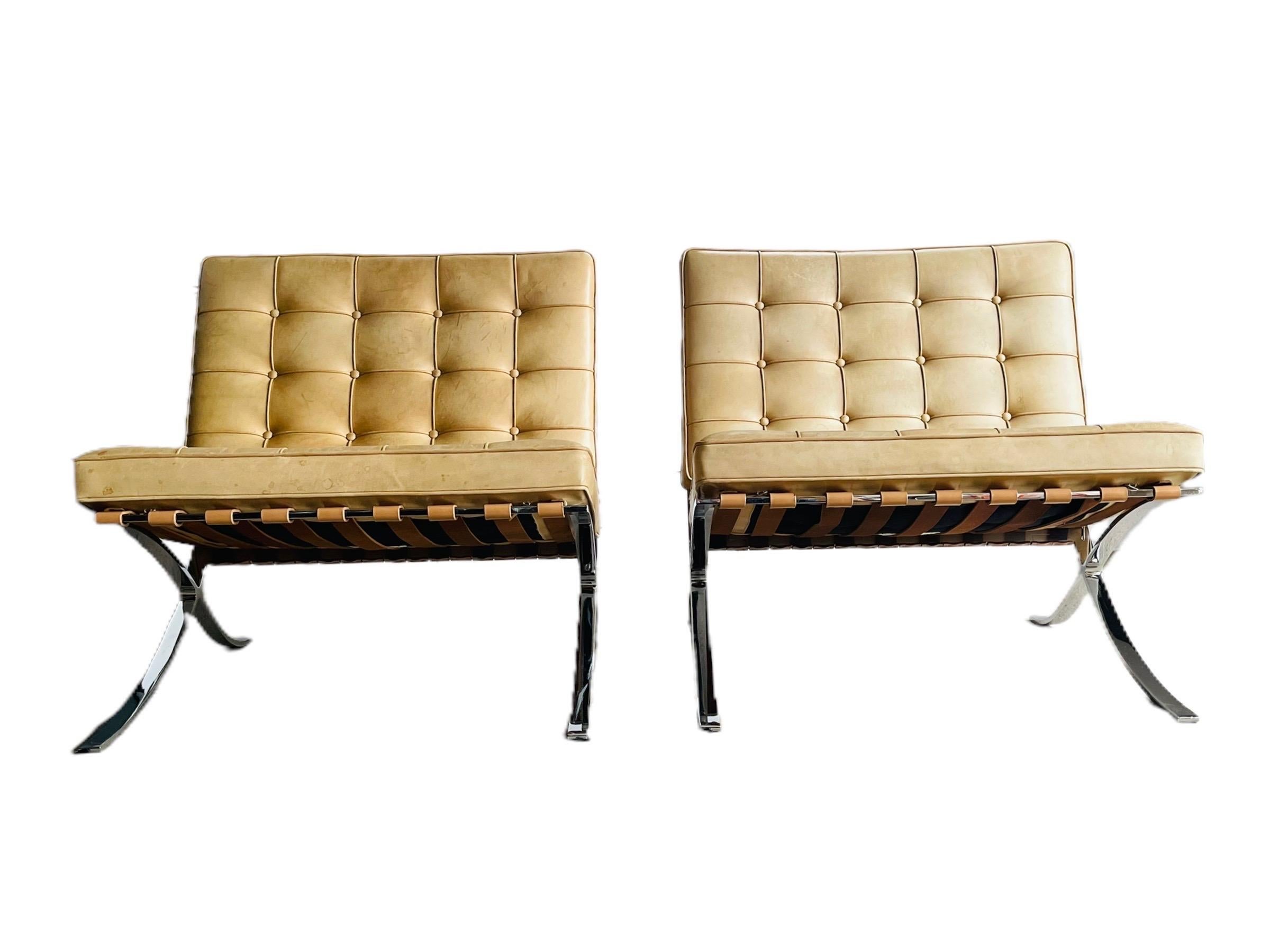 Exceptional and iconic split frame pair of Barcelona chairs designed by Ludwig Mies Van Der Rohe for Knoll Studio International in the most desirable tan/cream leather. The leather is nicely worn and has a nice patina. Both the cushions and the