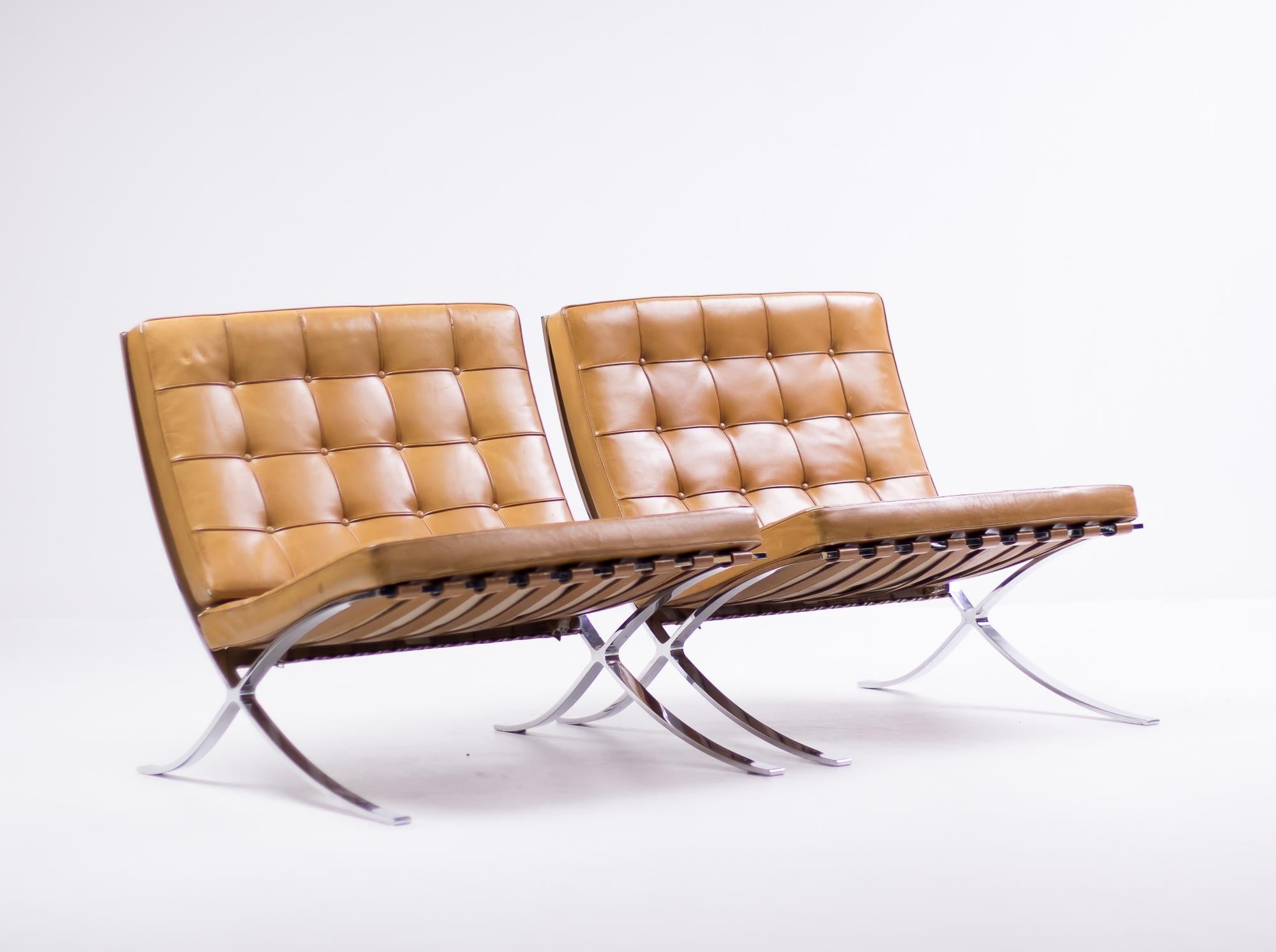 Exceptional split frame pair of Barcelona chairs by Mies Van der Rohe for Knoll International in the most desirable cognac leather.
Marked with Knoll logo on the inside of the cushions.