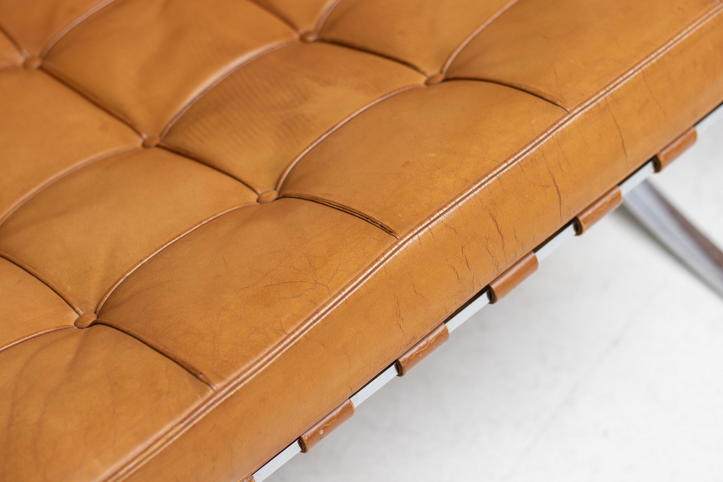 Exceptional split frame matching pair of Barcelona chairs by Mies Van der Rohe for Knoll International in the most desirable natural cognac leather. Wonderful all original condition with some wear and creasing to the leather as one would expect from