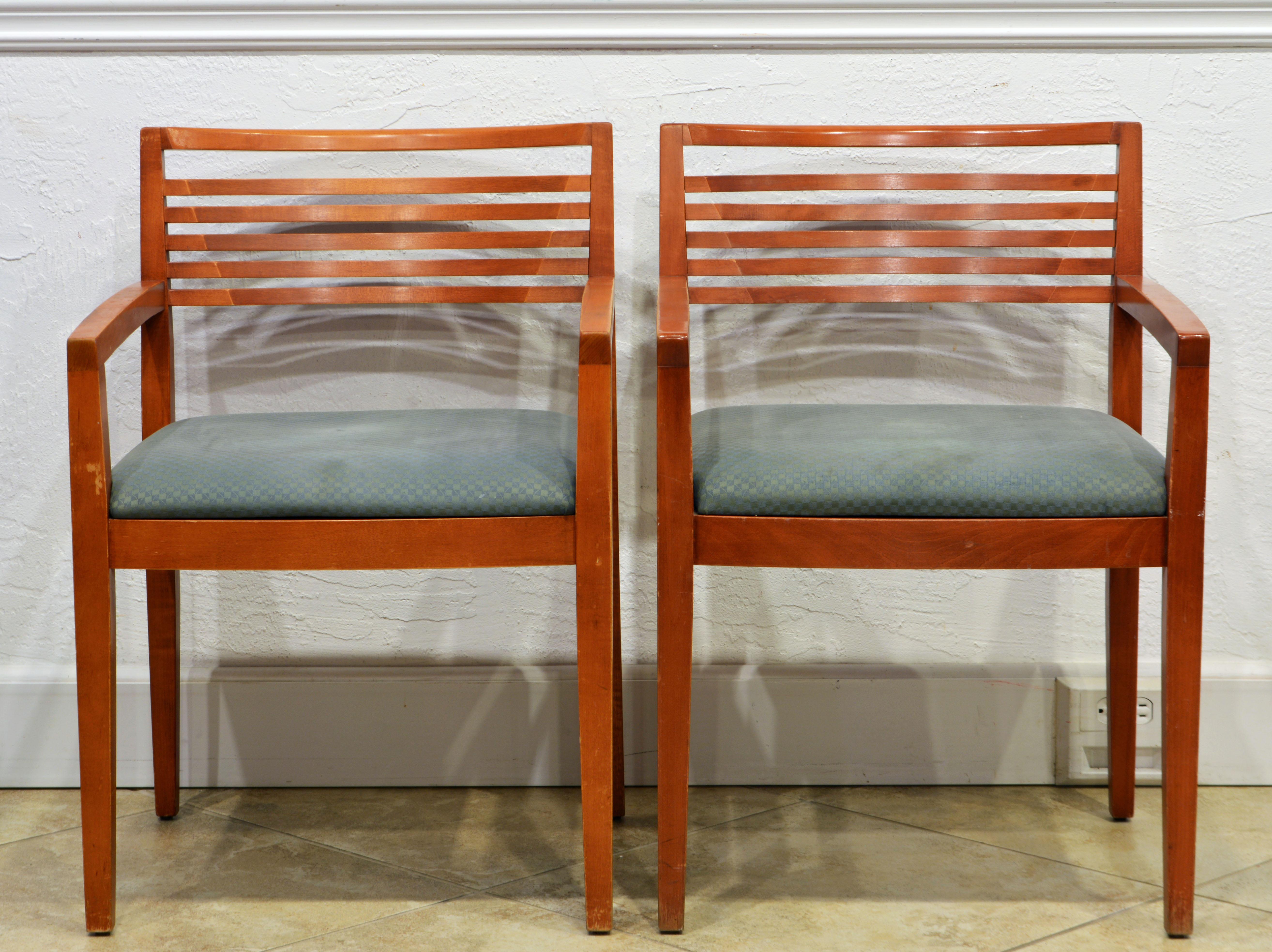 A pair of authentic and signed Ricchio arm chairs by Knoll Studio, These chairs won a Roscoe design award in 1991 for Linda and Joe Ricchio, With an effortless aesthetic and traditionally-inspired construction the Ricchio chair is a classic modern