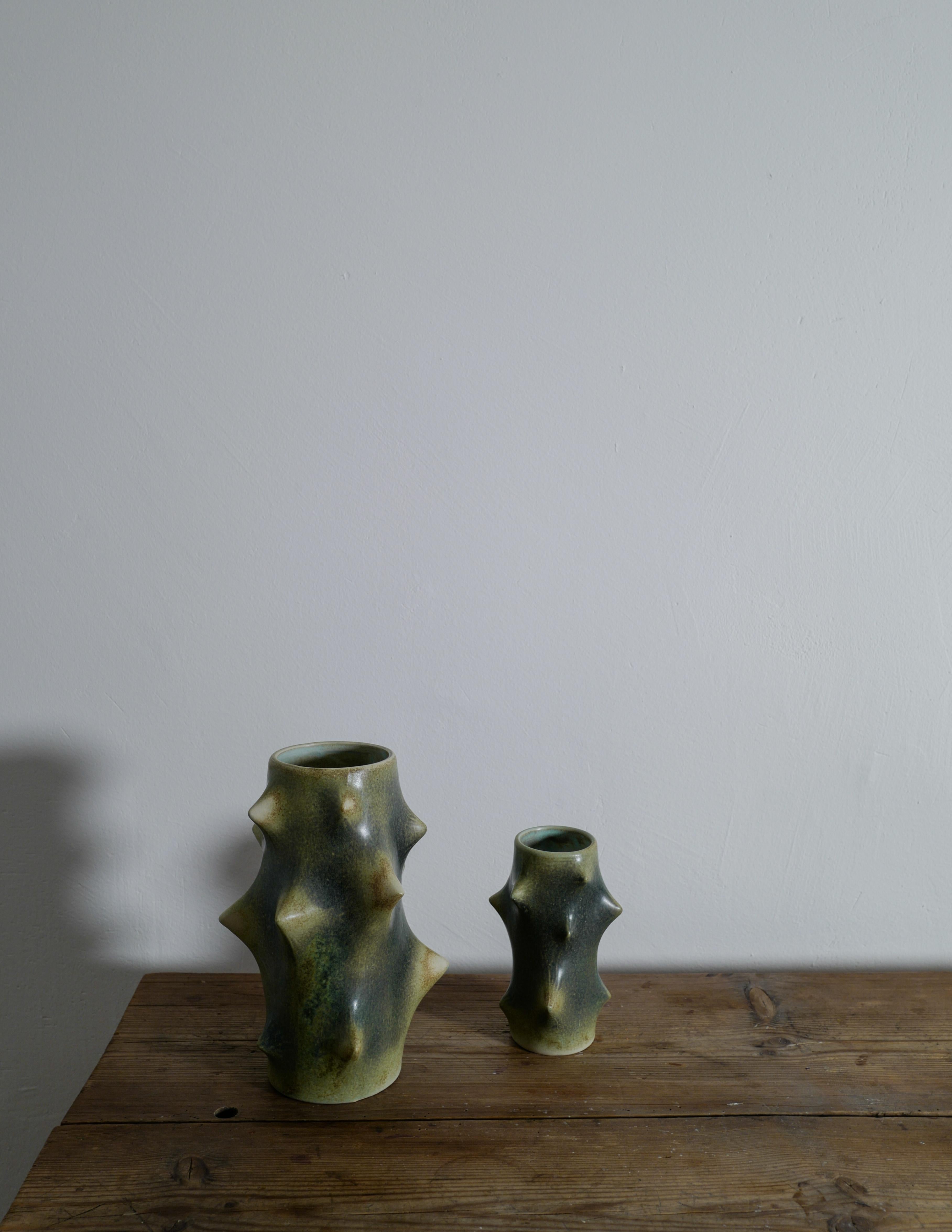 Rare pair of Knud Basse vases for Michael Anderson & Son, Denmark. Designed in the 1950s. 
This pair is in excellent vintage condition with small signs from use and color is perfectly matching. 

Larger one is 26 cm tall and 18 cm at the widest