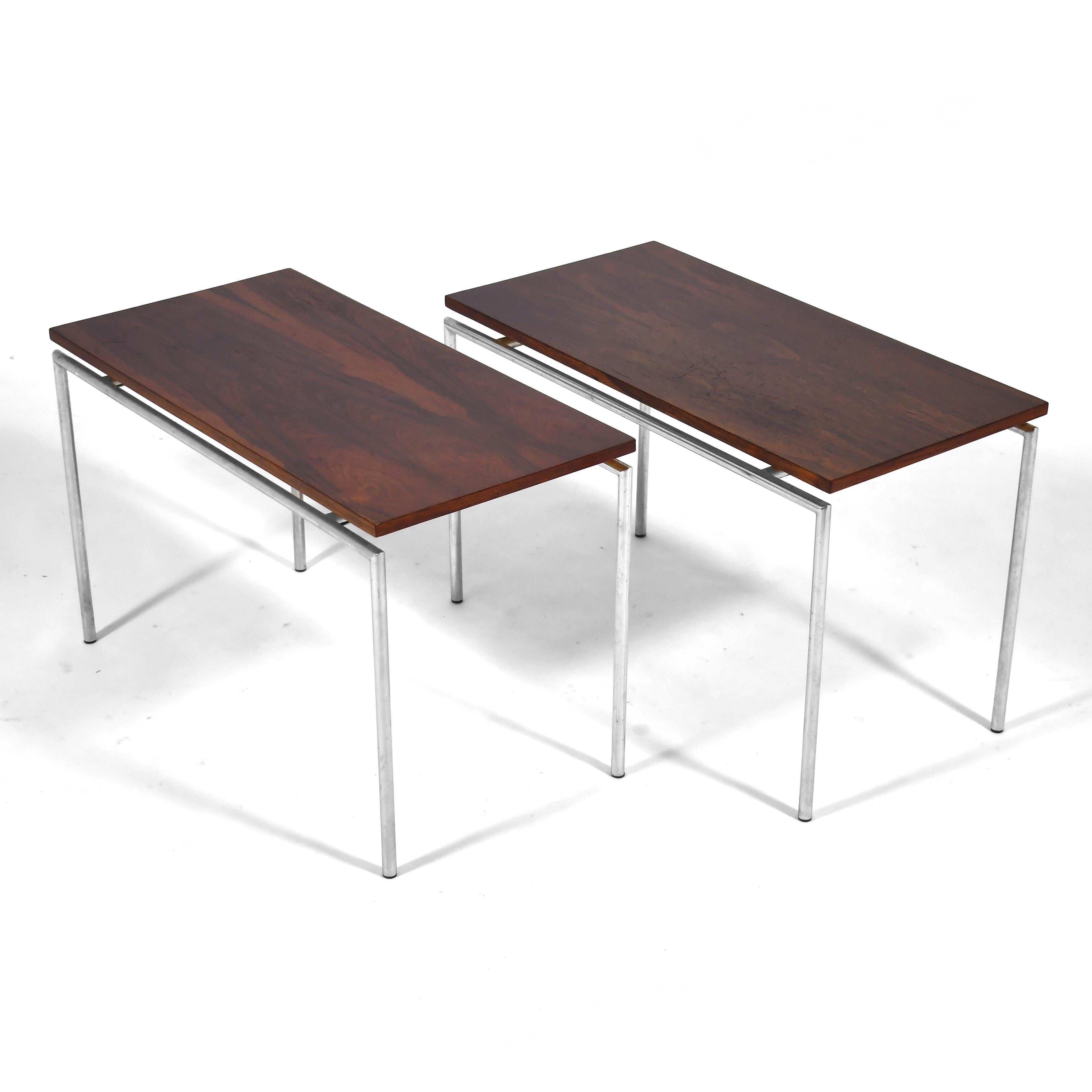 This understated and sleek pair of side tables by Knud Joos for Jason Mobler subscribe to the minimalist strain of Danish modern as practiced by Poul Kjaerholm. The slim tops of rich rosewood appear to float over their lean chrome bases.

17.5