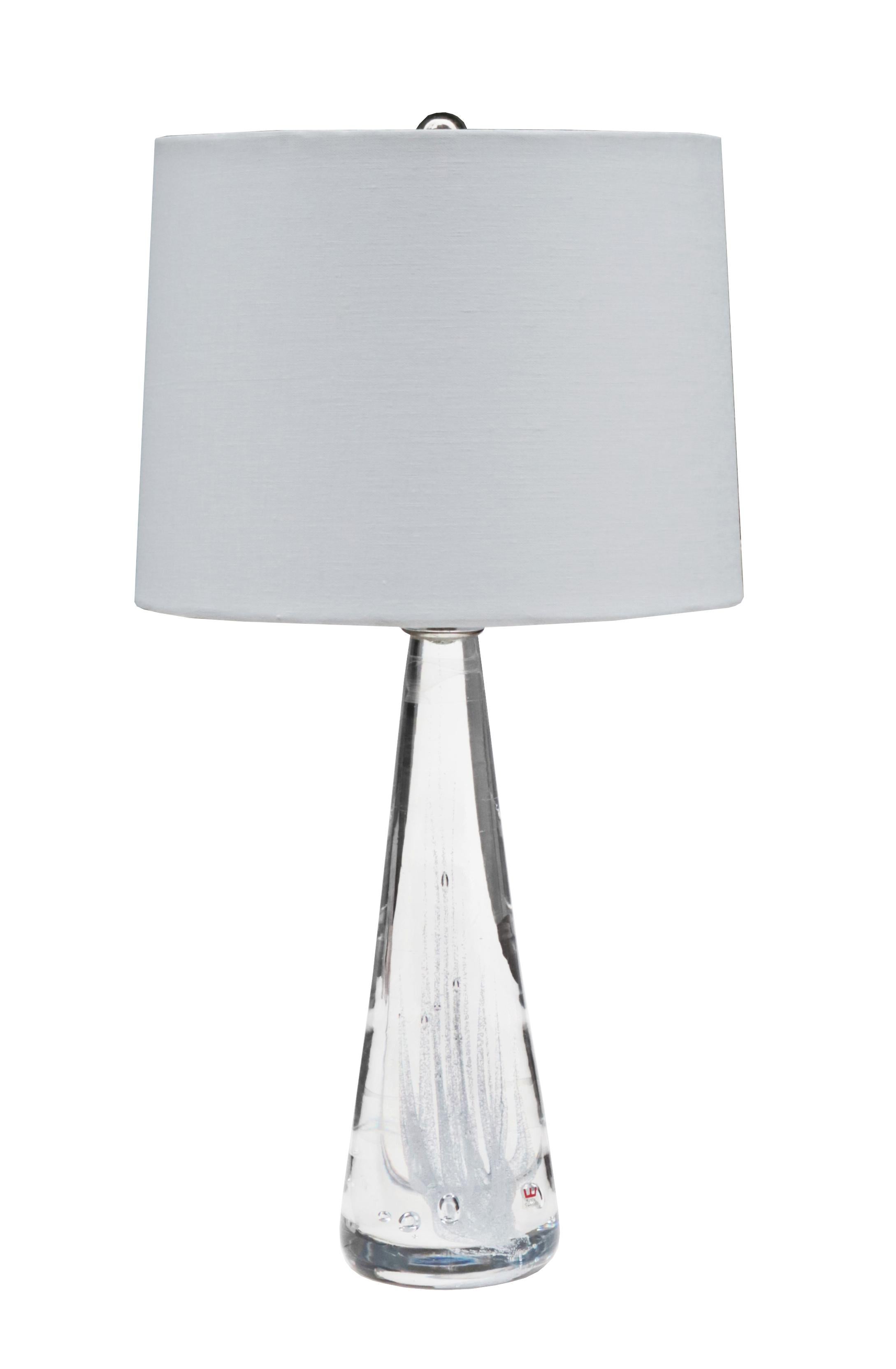 Pair of Swedish modern glass table lamps
by Vicke Lindstrand for Kosta.
Clear glass with air bubble inclusion details.
 