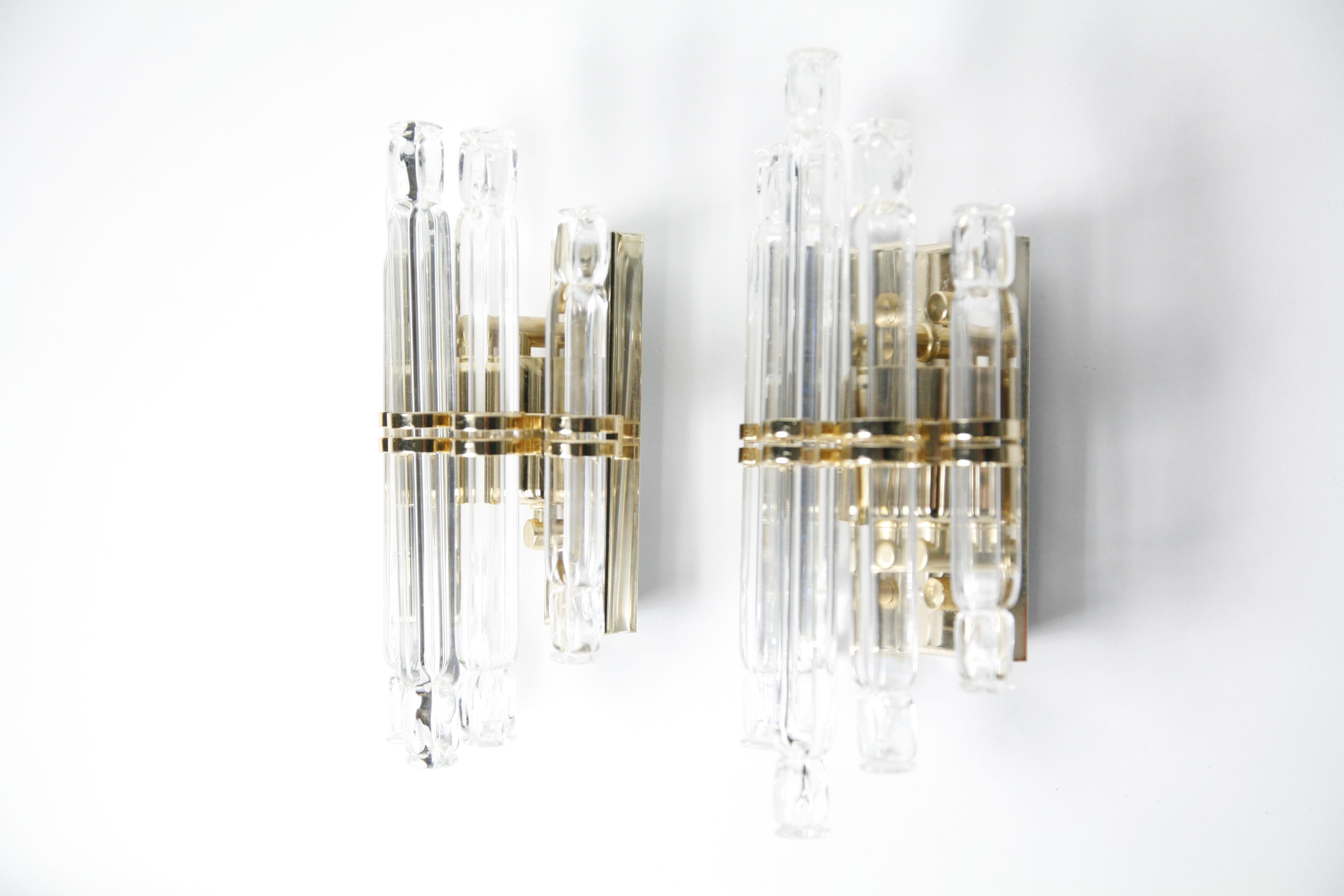 Pair of Kowatz leuchten sconces Germany, 1980, consisting of gilded frames with 5 individual crystal glass rods as a shade, elegant look.
Nicely detailed with tiny gold turn switch.
Hold two candelabra bulbs each, rewired for the US.

The length