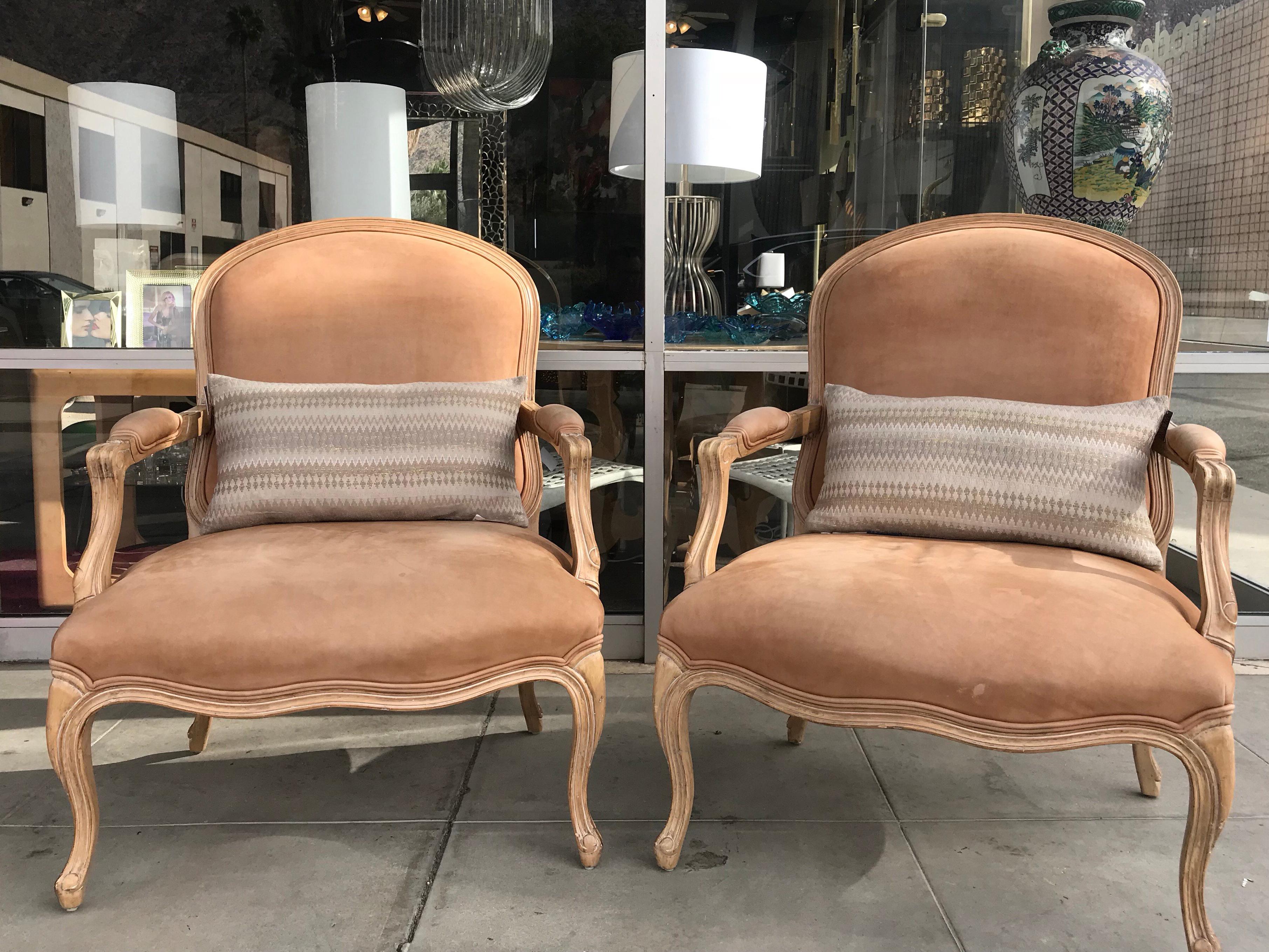 A very chic pair of Bergere chairs made by Kreiss in the late 1980s for a Palm Springs Country Club Estate. In very modern light wood with antique painted finish. The chairs are in the largest 'living room