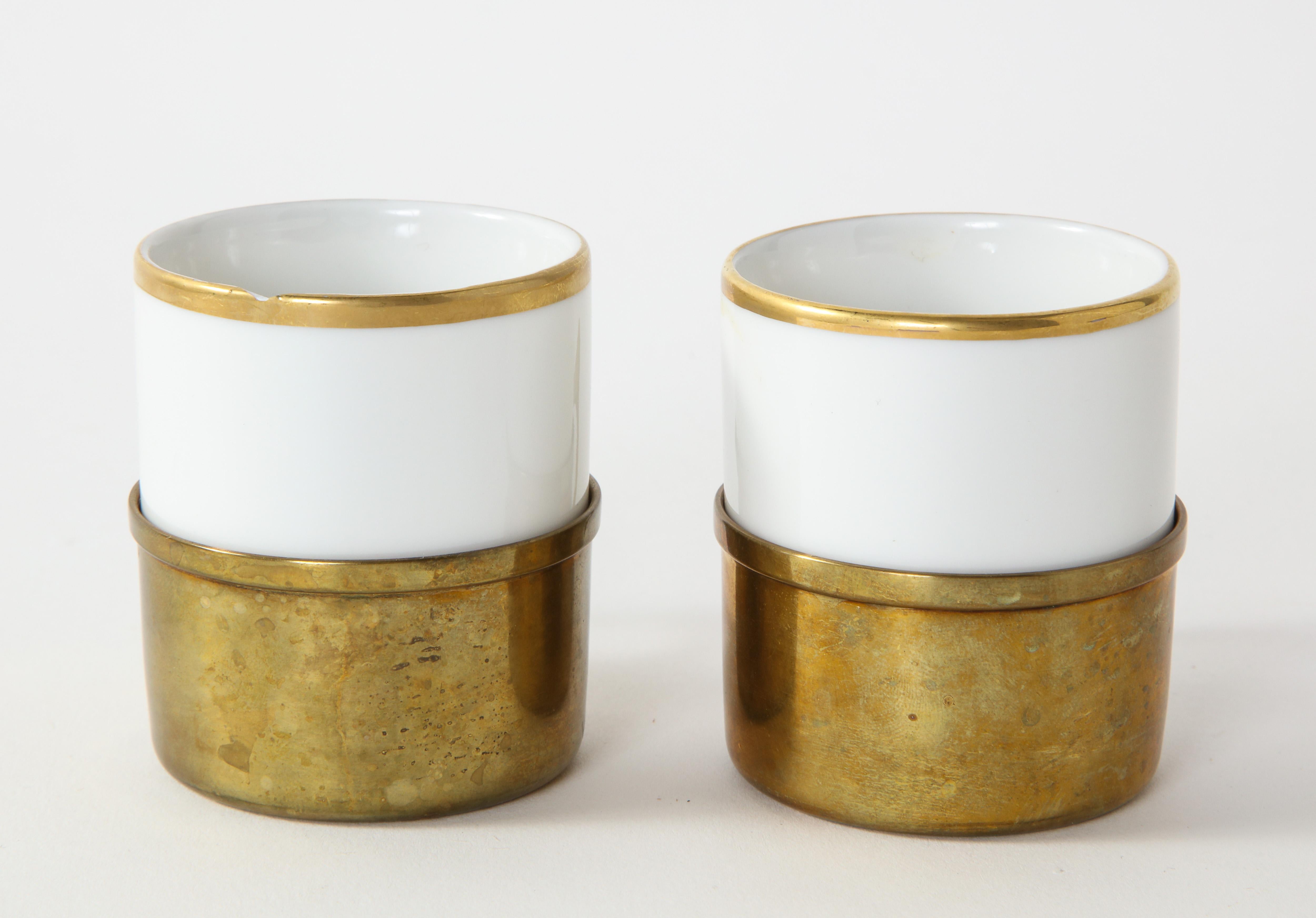 Pair of porcelain and brass art deco style demitasse cups by Kronester Bavaria.