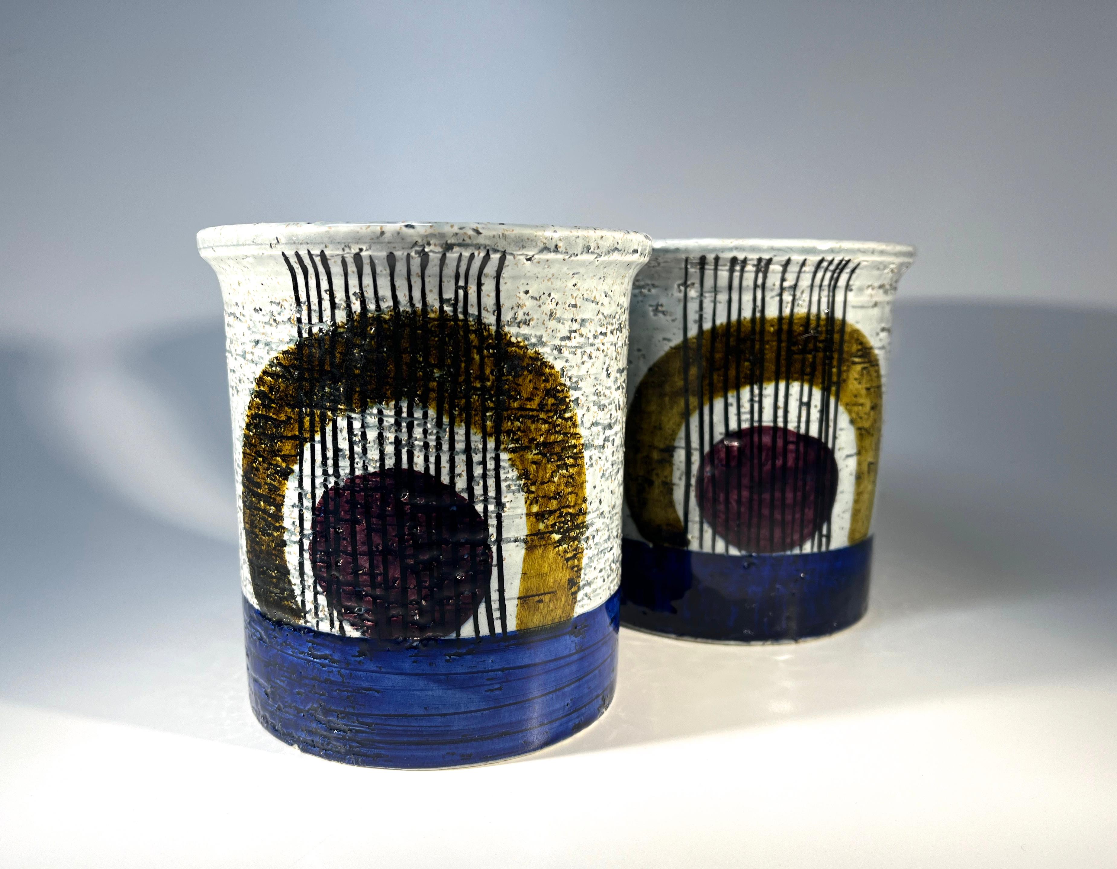 Distinctive 'Kurbit' series pair of vases by Olle Alberius for Rörstrand, Sweden
Hand painted bold abstract decoration on pale grey glaze
Stamped 'R' Sweden, Kurbits OA 5 on bases
Height 5 inch, Dia 4.5 inch
Circa 1960's
In excellent condition.