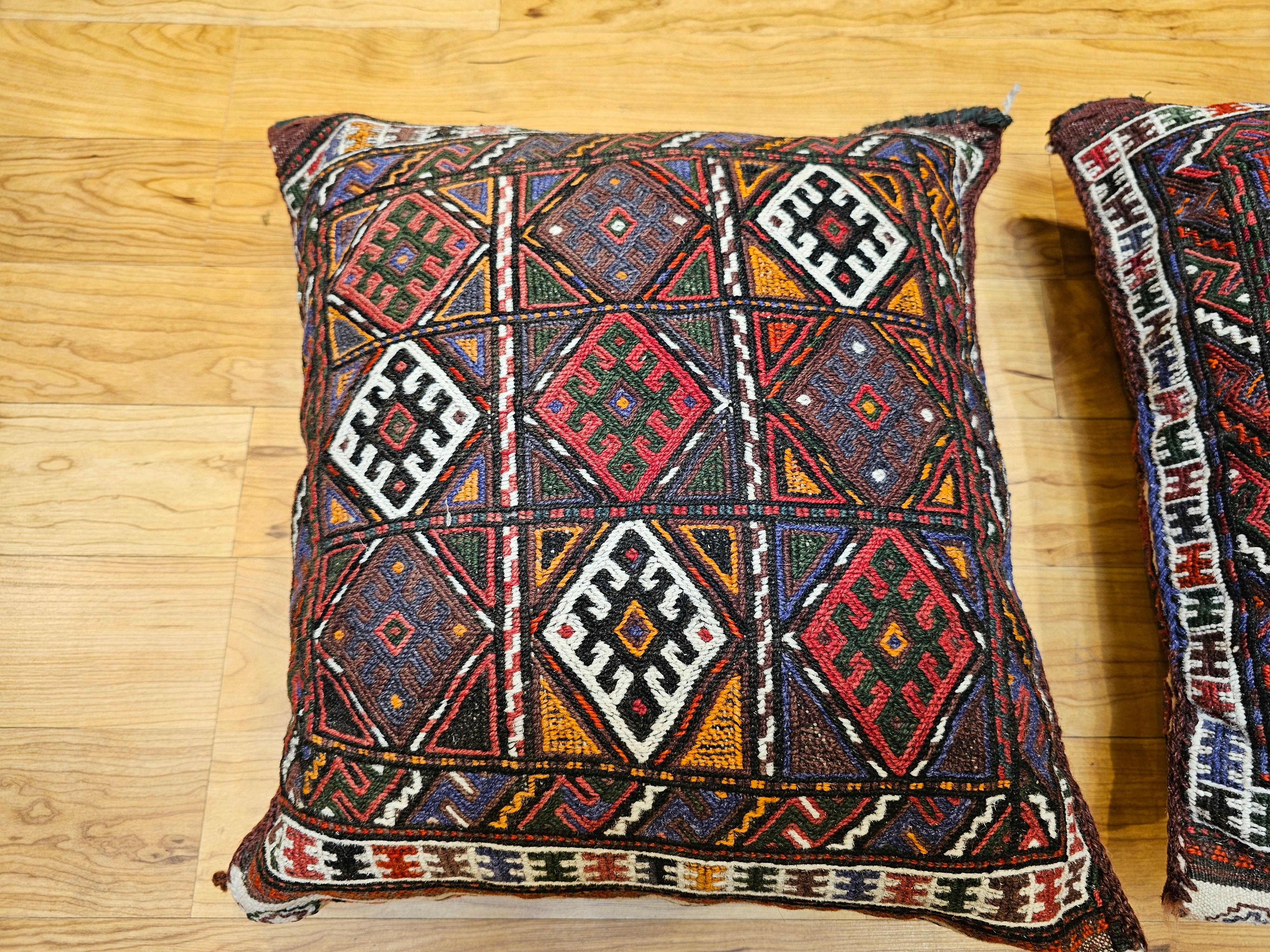 Persian Pair of Kurdish Saddlebag Pillows in Red, Green, Ivory, Purple, Cornmeal For Sale